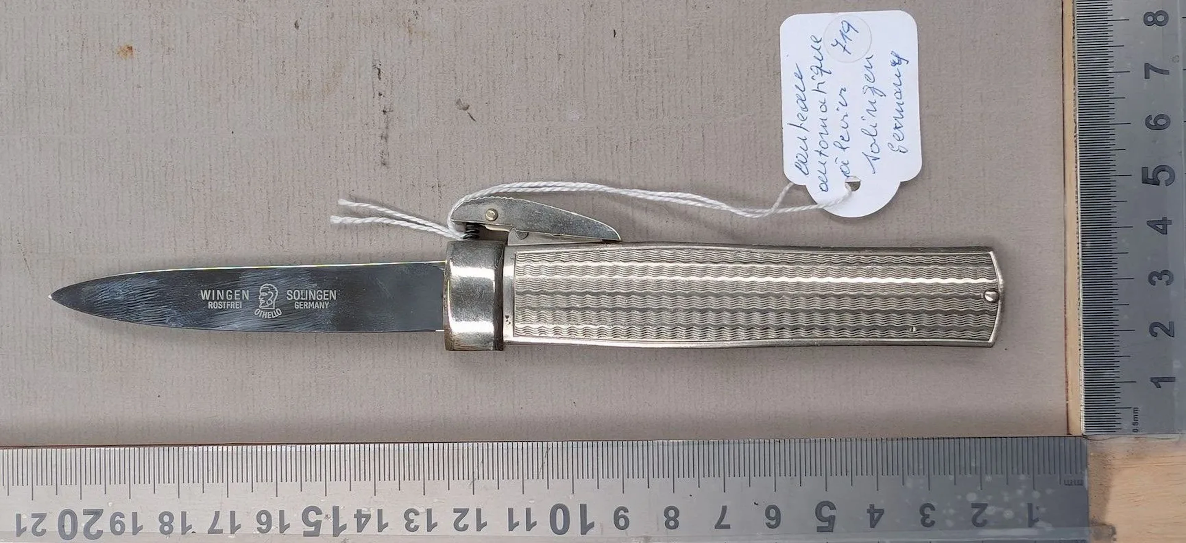 An antique SOLINGEN GERMANY lever-action folding knife—see photos