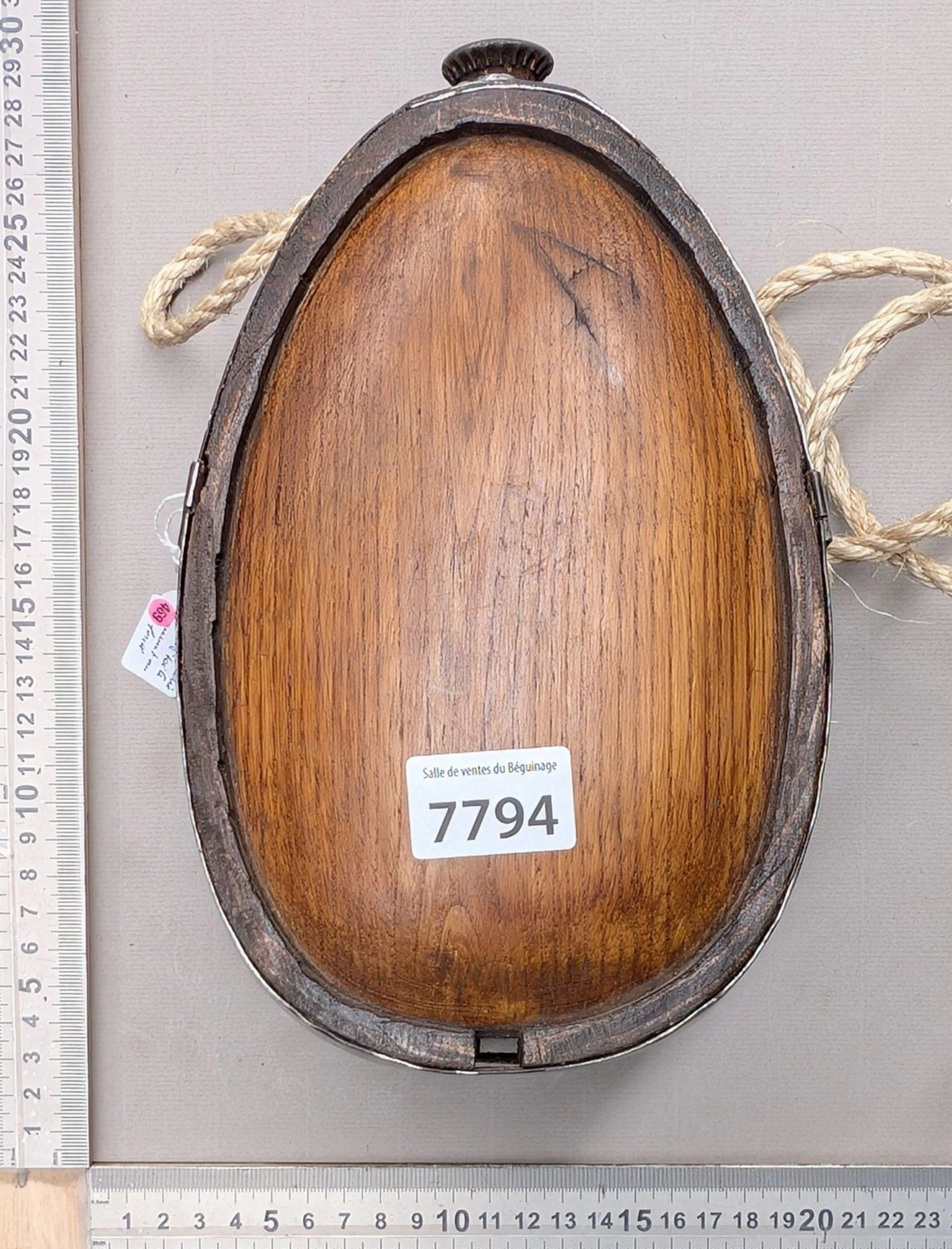 Cute little wooden and wrought-iron barrel, open at the bottom—see