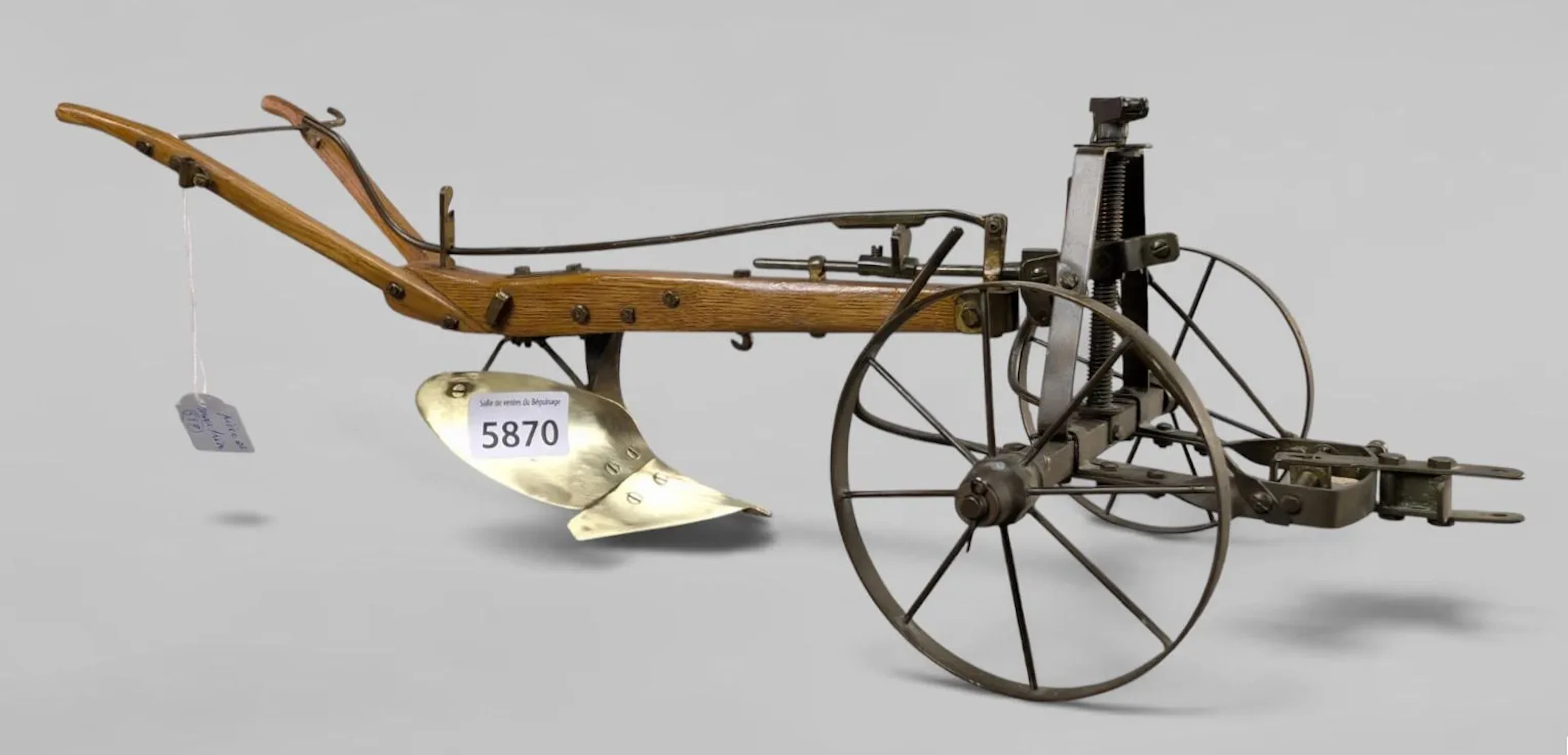A model of an antique plow—see photos for dimensions and condition