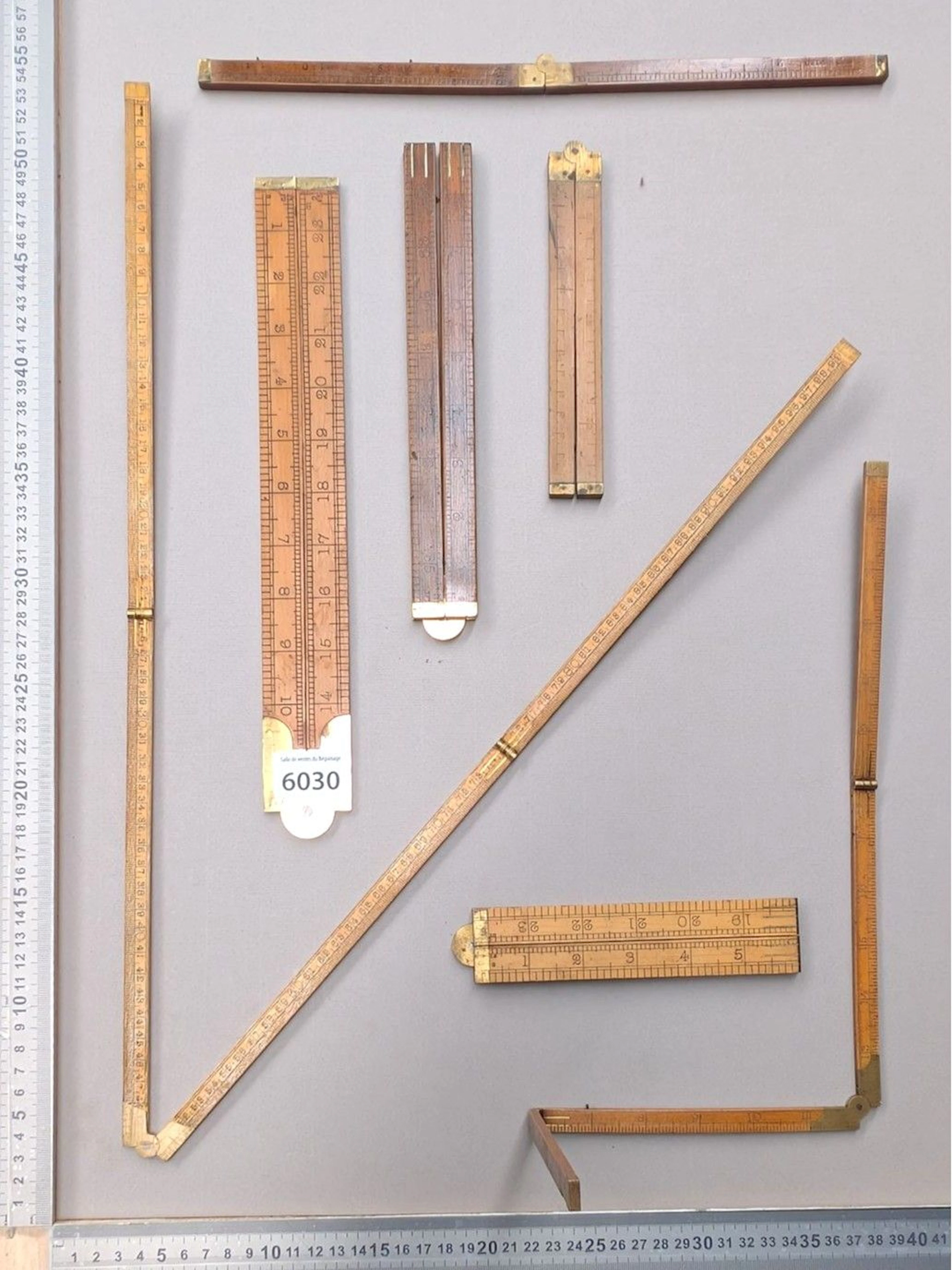 7 beautiful Roy folding stands made of wood and brass—see photos for