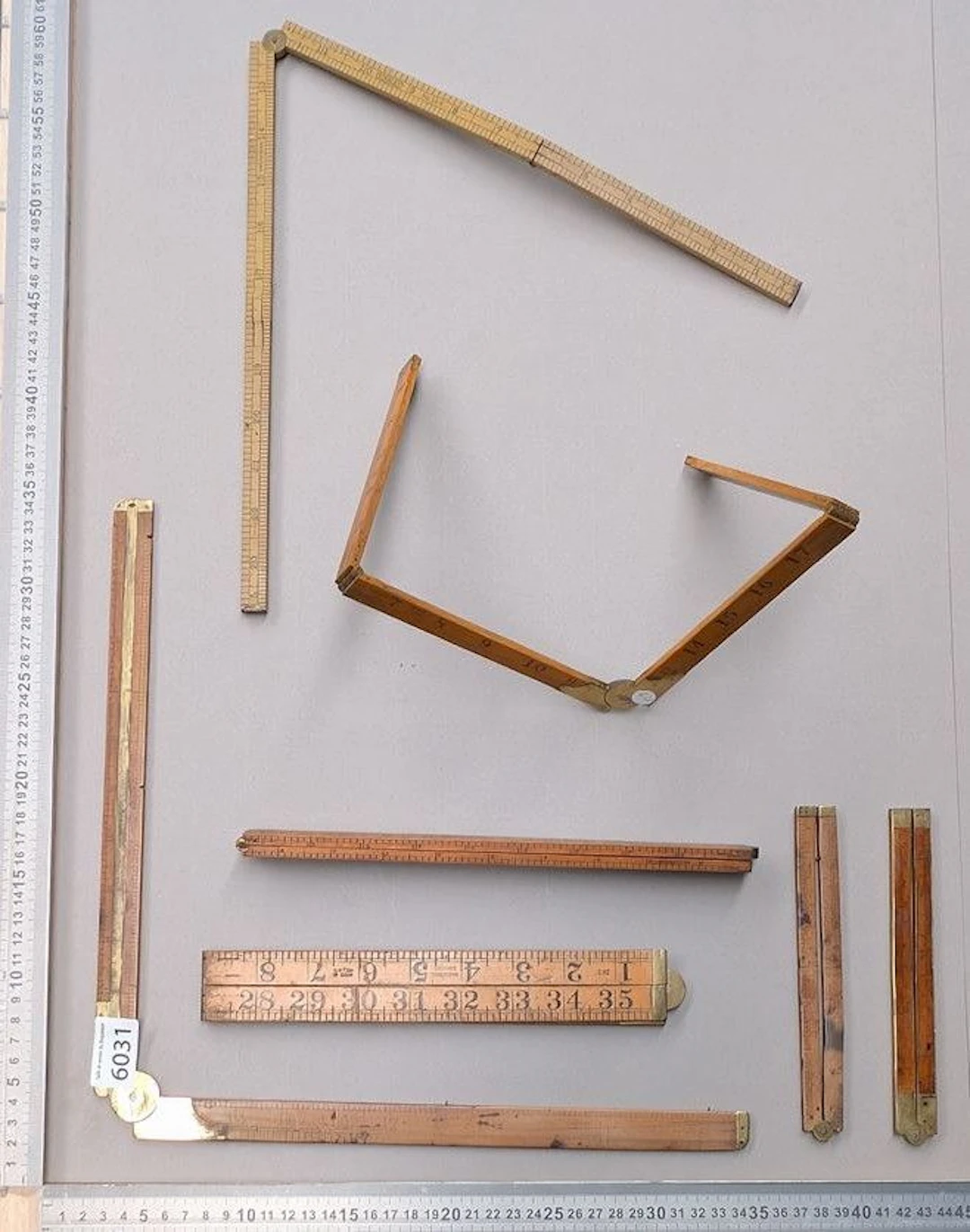 7 beautiful Roy folding stands made of wood and brass—see photos for