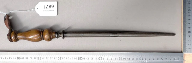 Antique butcher's sharpening knife with wooden handle, 20th century—see