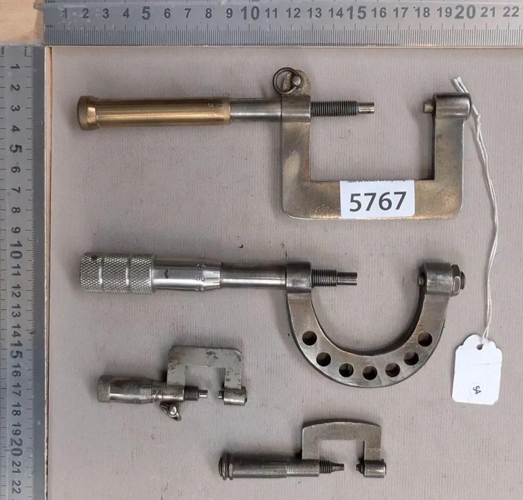 4 micrometers; this Palmer tool is used for precision diameter measurement—see