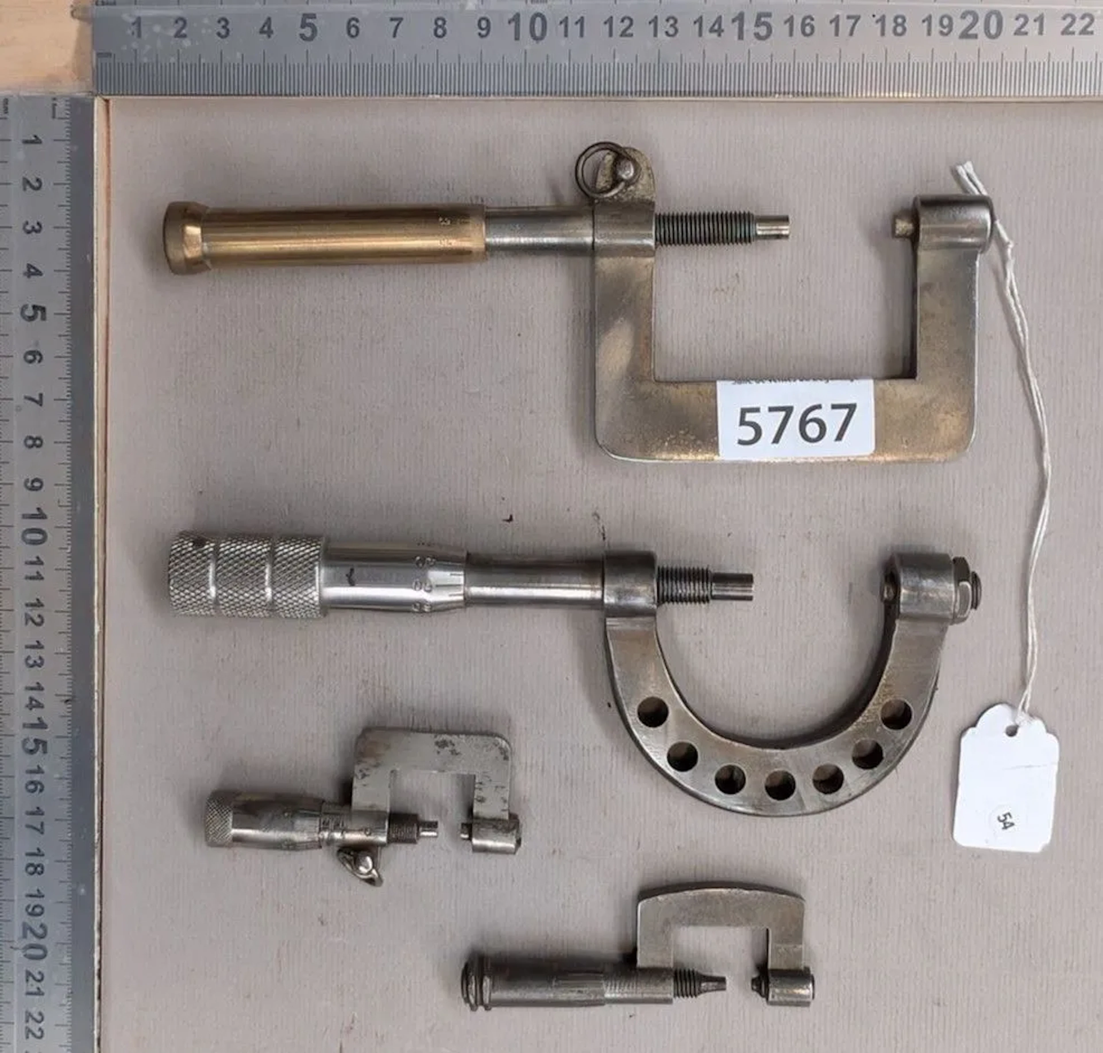 4 micrometers; this Palmer tool is used for precision diameter measurement—see