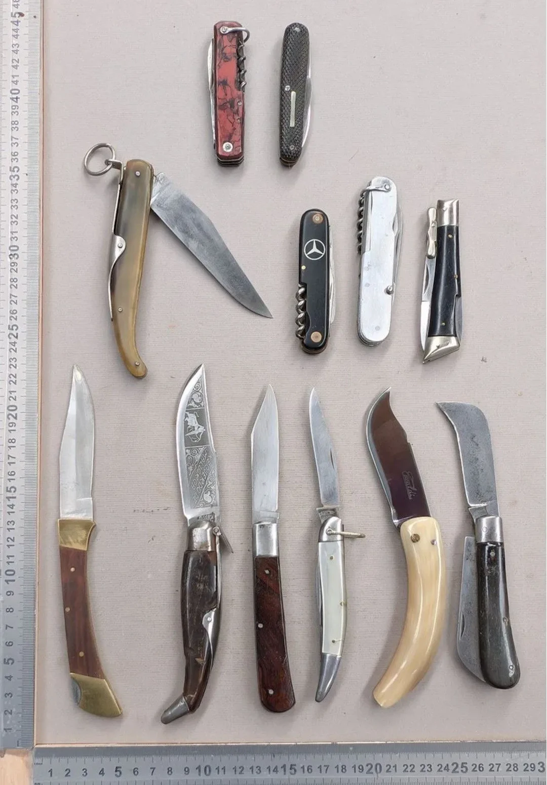 Set of 12 different vintage pocket knives, 1930–1950—see photos for
