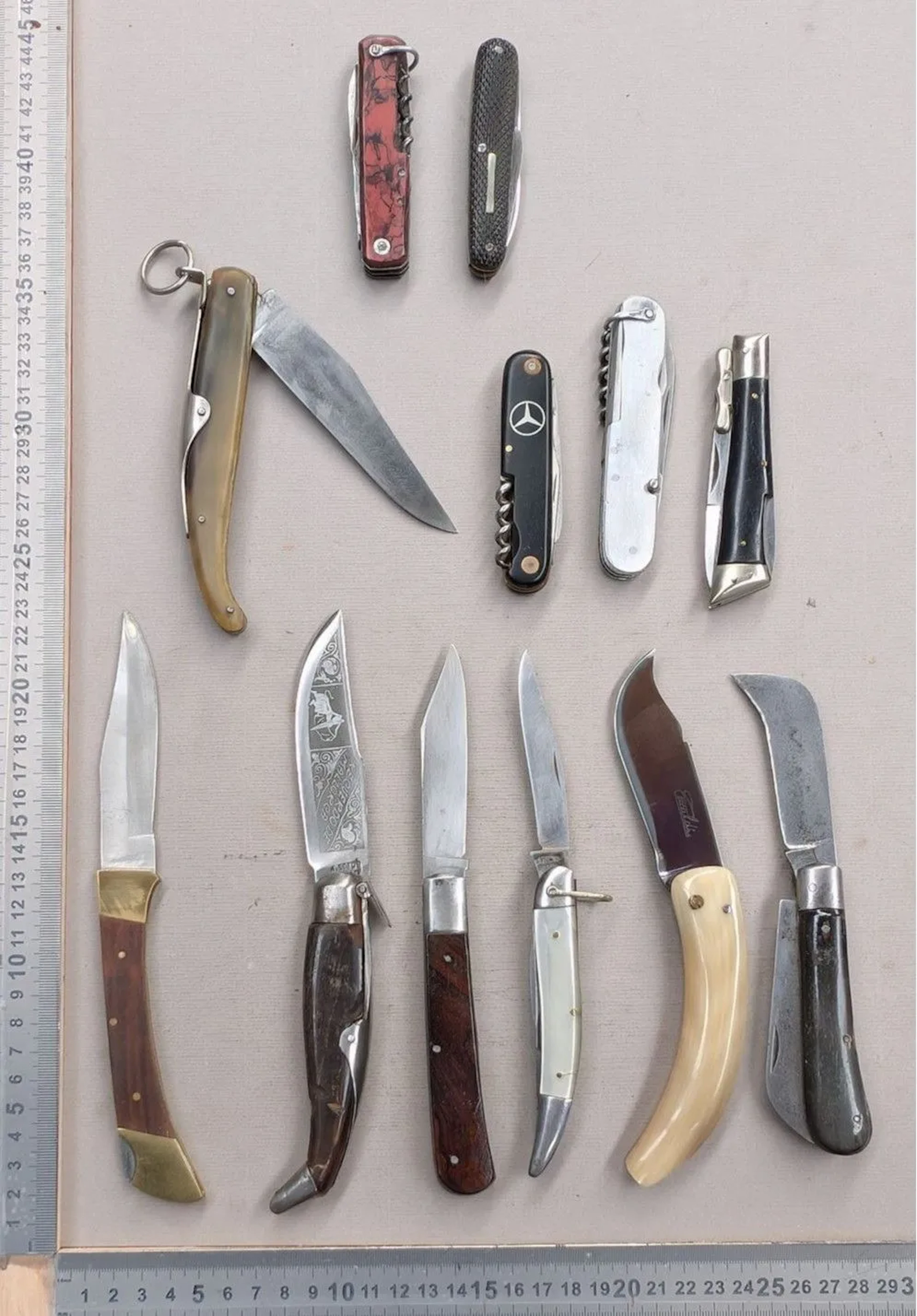 Set of 12 different vintage pocket knives, 1930–1950—see photos for