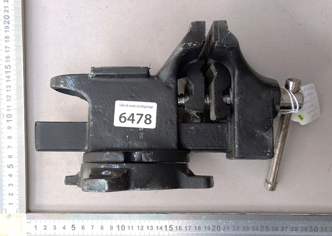1 cast-iron swivel bench vise—see photos for dimensions and condition