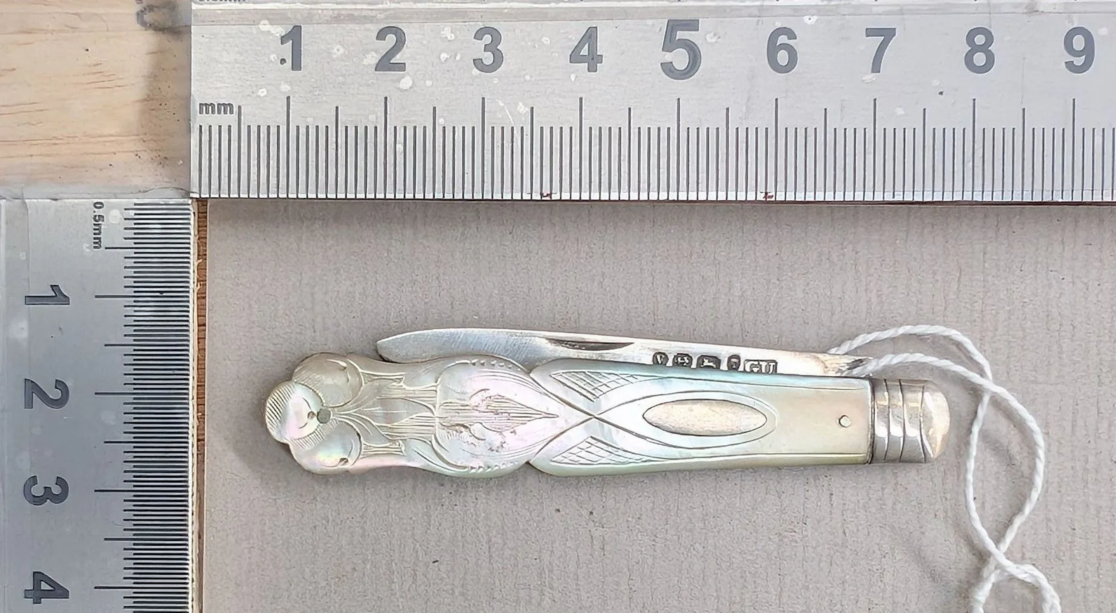 1 antique fruit knife with a silver blade and mother-of-pearl handle—see