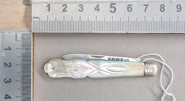 1 antique fruit knife with a silver blade and mother-of-pearl handle—see