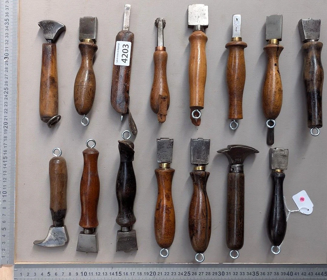 15 shoemaker's and saddler's tools on an oak base—see photos for dimensions