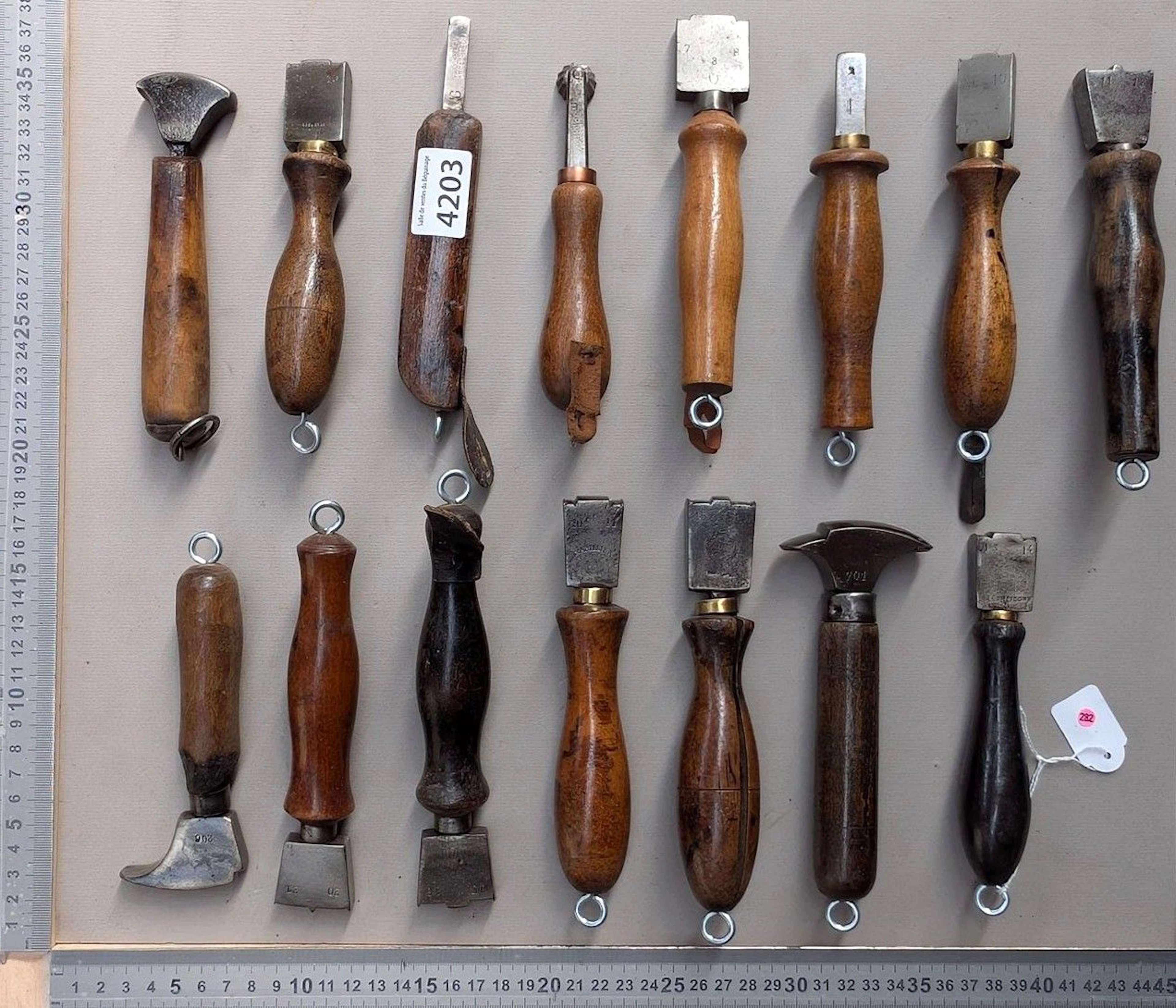 15 shoemaker's and saddler's tools on an oak base—see photos for dimensions