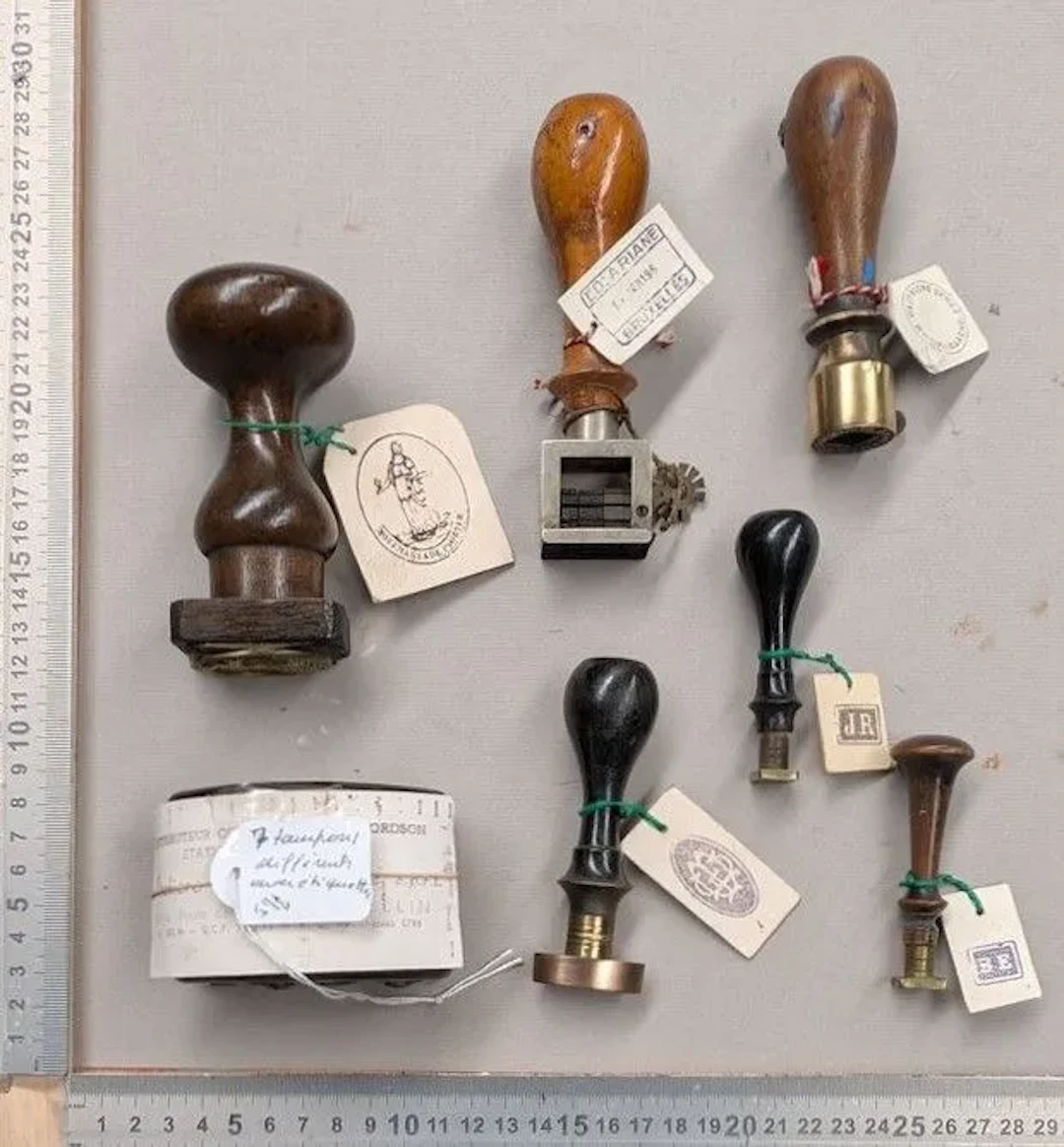 7 different vintage stamps—see photos for dimensions and condition