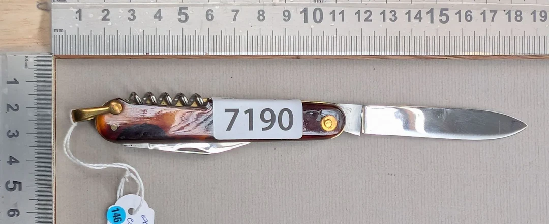 Antique pocket knife with 2 blades and 1 tortoiseshell corkscrew—see