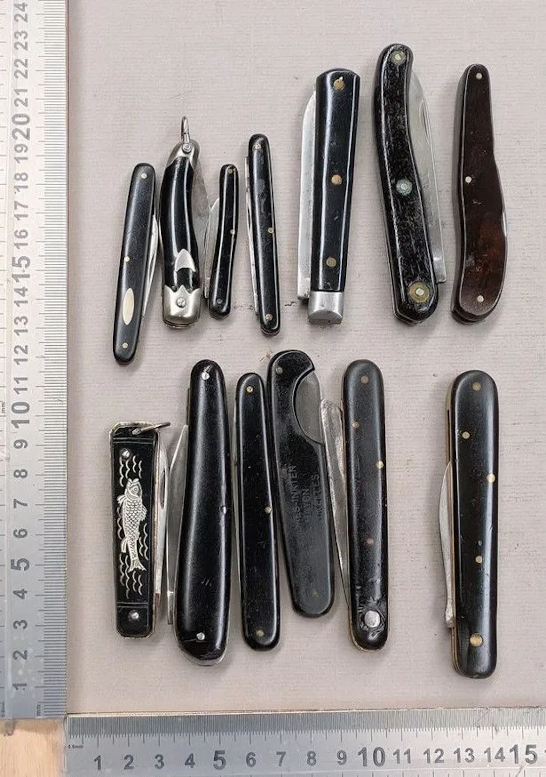 Set of 13 antique French utility folding pocket knives, 1900–1920