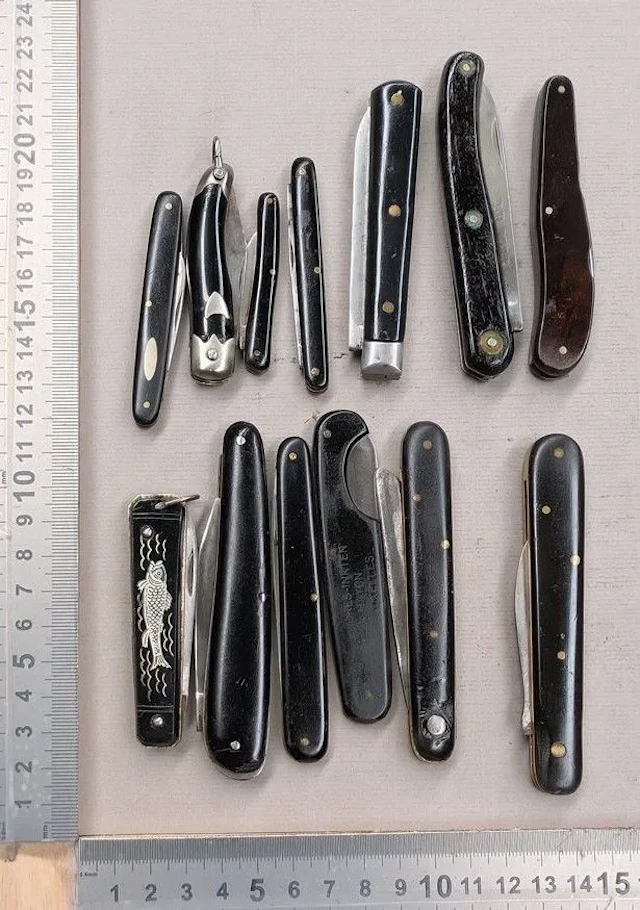 Set of 13 antique French utility folding pocket knives, 1900–1920