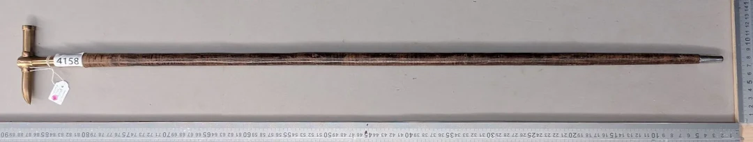Geologist's walking stick with a leather disc handle—see photos for