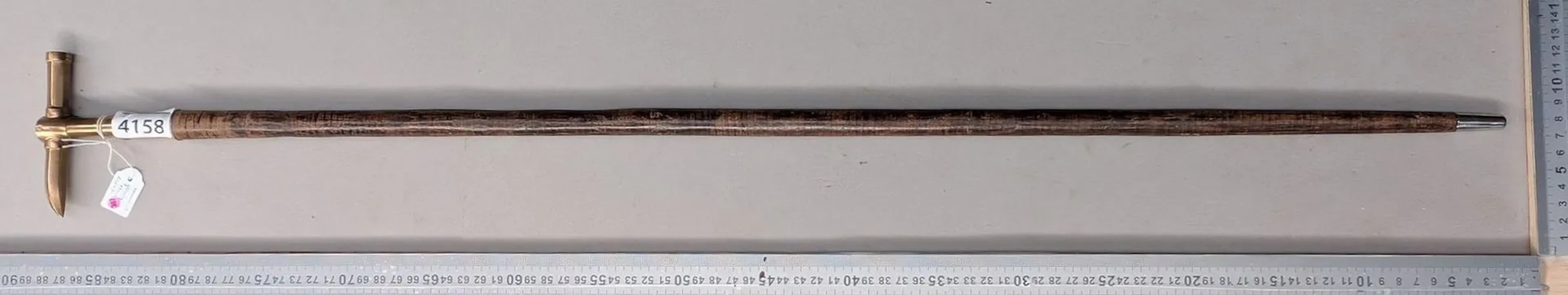 Geologist's walking stick with a leather disc handle—see photos for