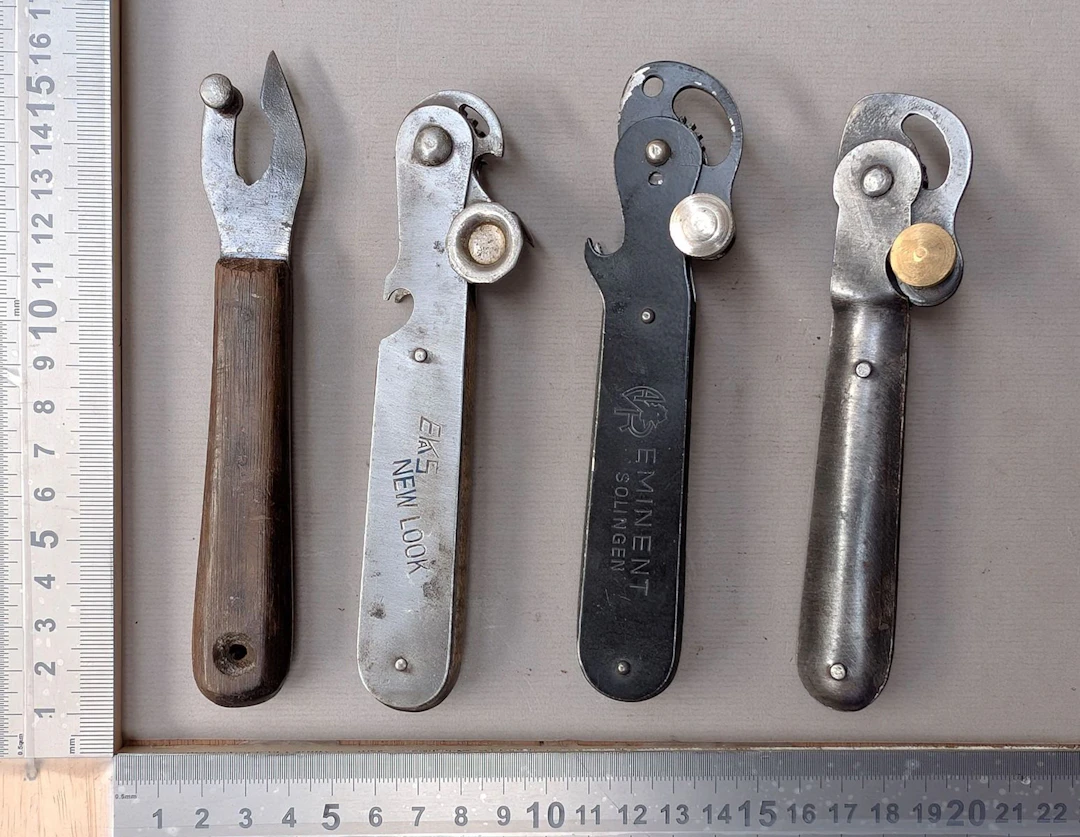 4 antique can openers—see photos for dimensions and condition