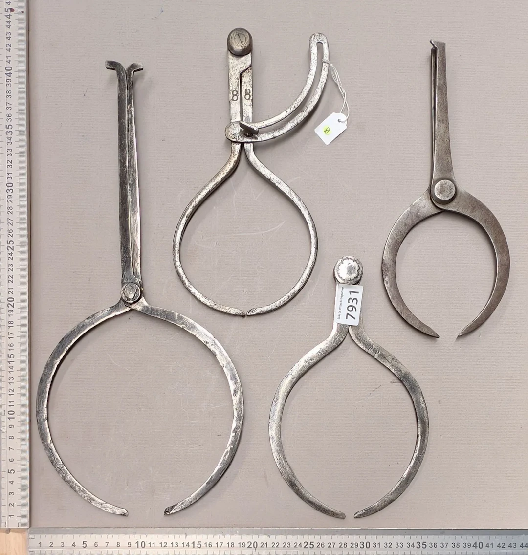 1 set of 4 different compasses—see photos for dimensions and condition