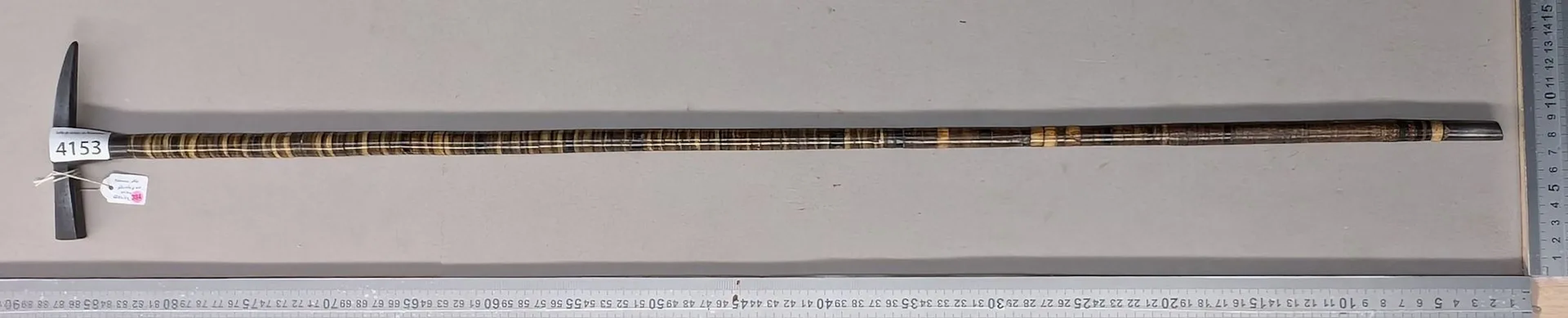 Geologist's walking stick with a leather disc handle—see photos for
