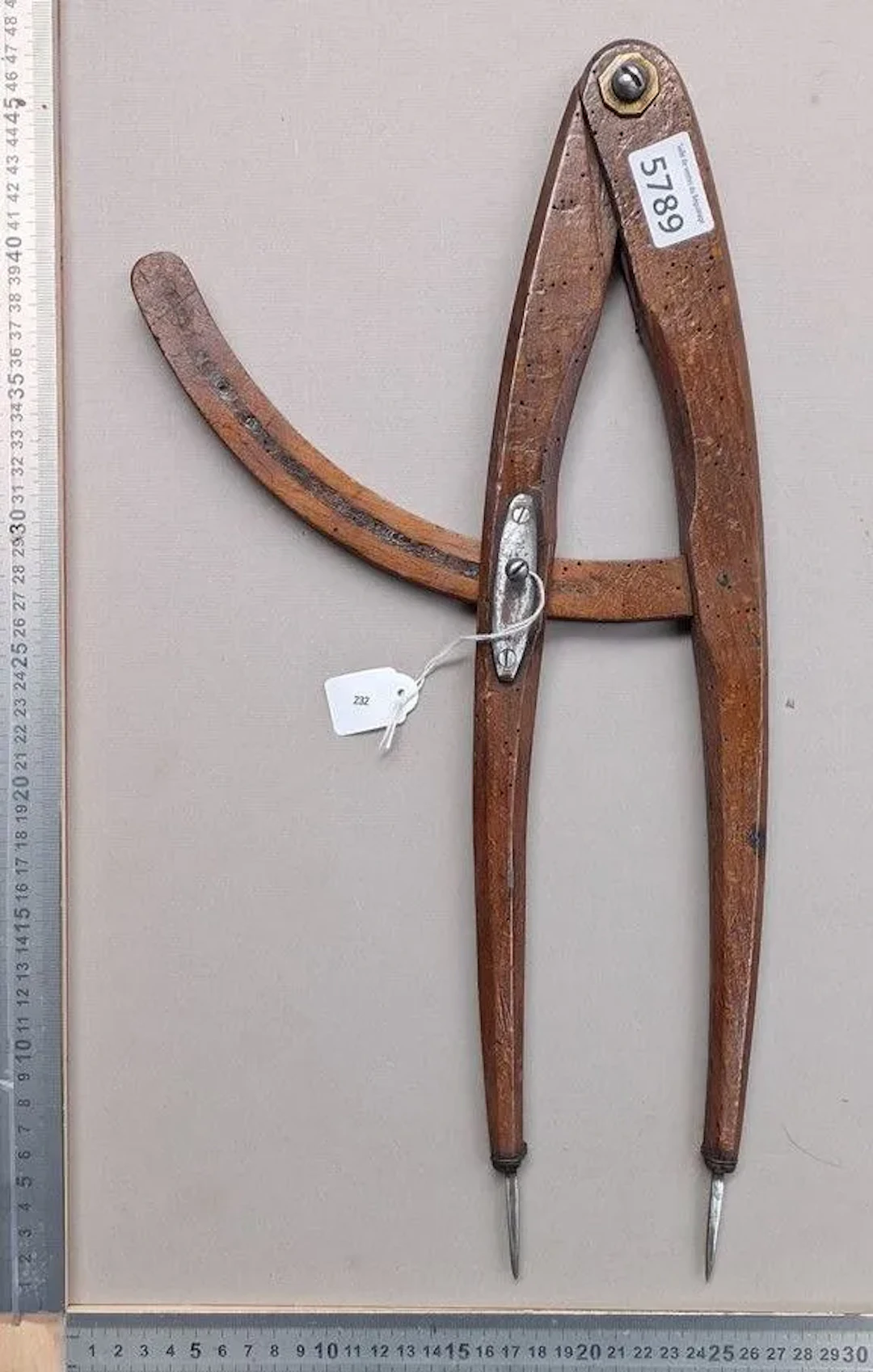 An antique wooden compass with a forged metal needle, 1880—see photos