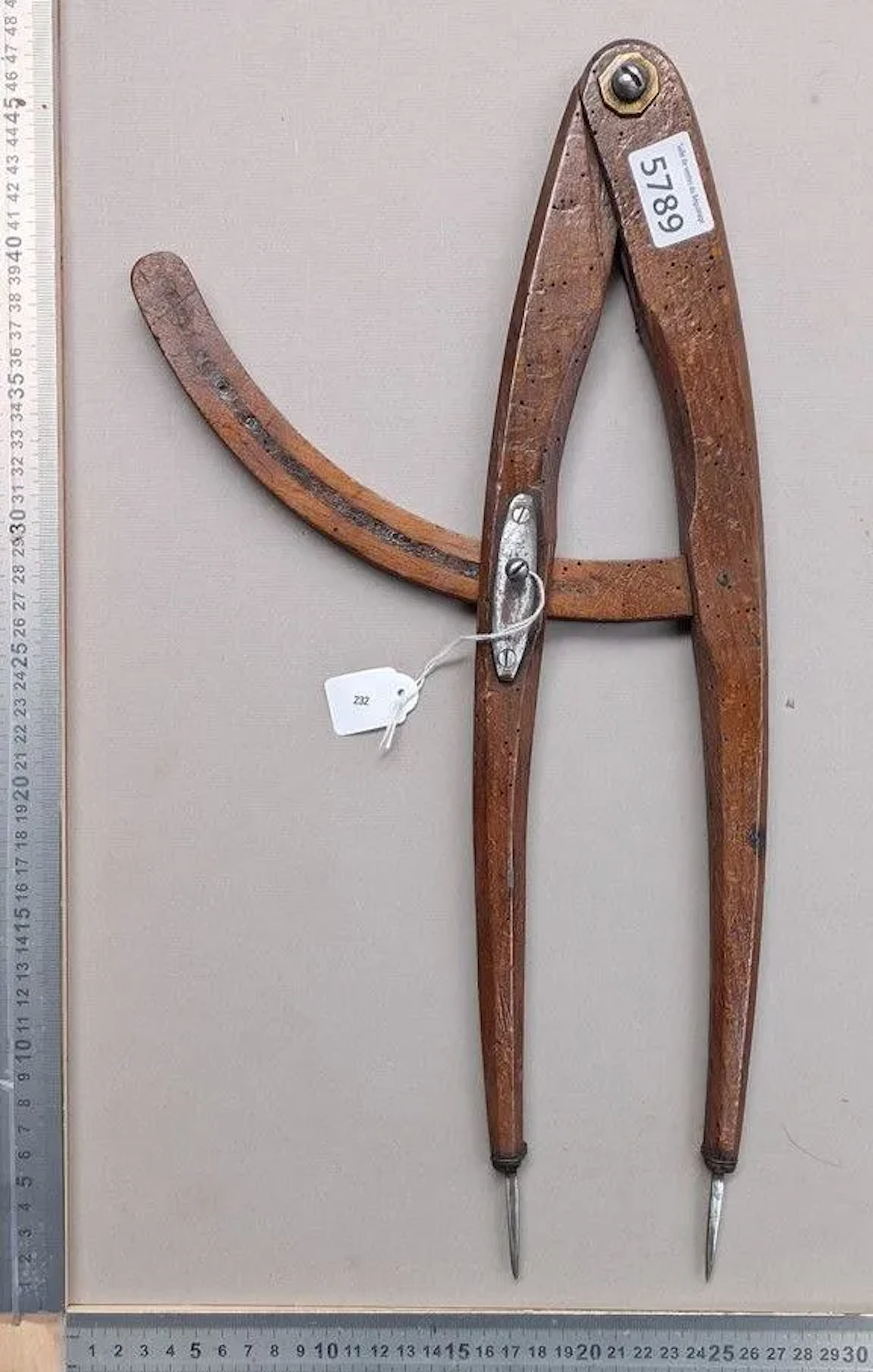 An antique wooden compass with a forged metal needle, 1880—see photos