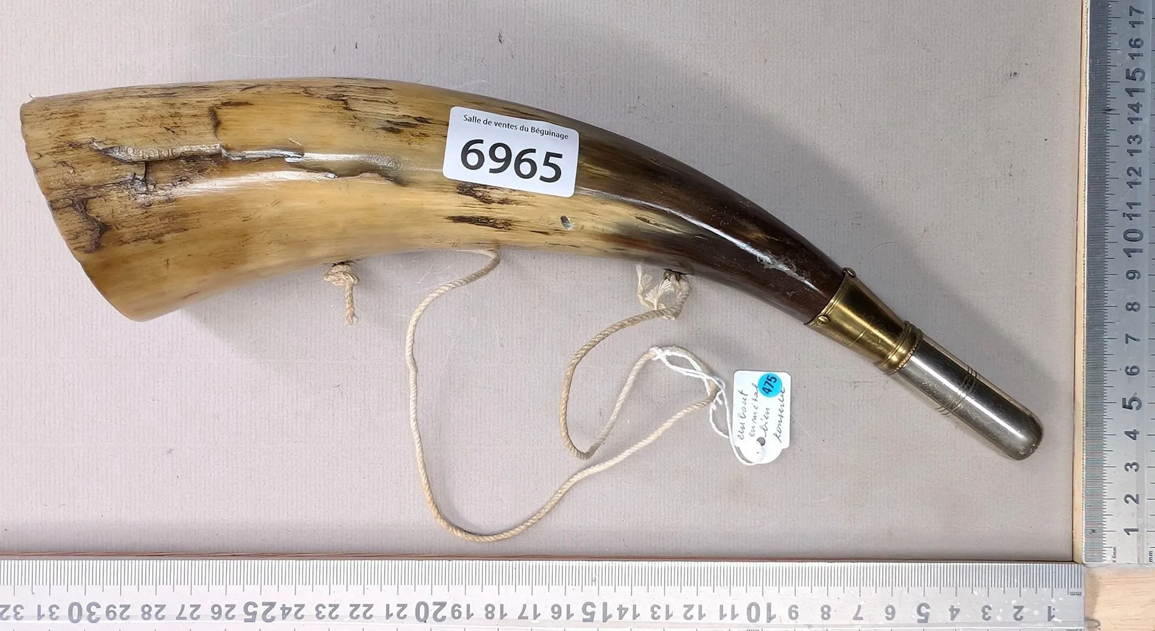 A very beautiful hunting horn with a well-preserved metal tip—see