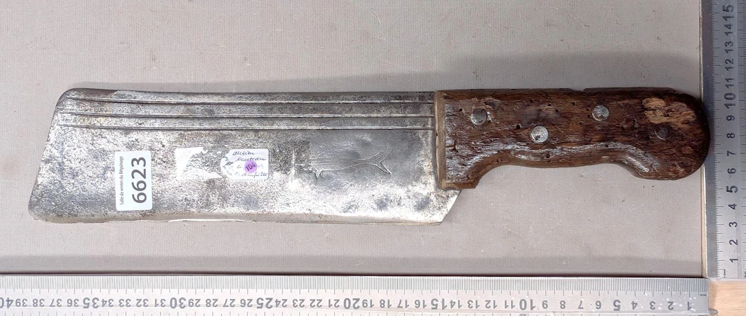 Antique cleaver with steel blade and wooden handle—see photos for