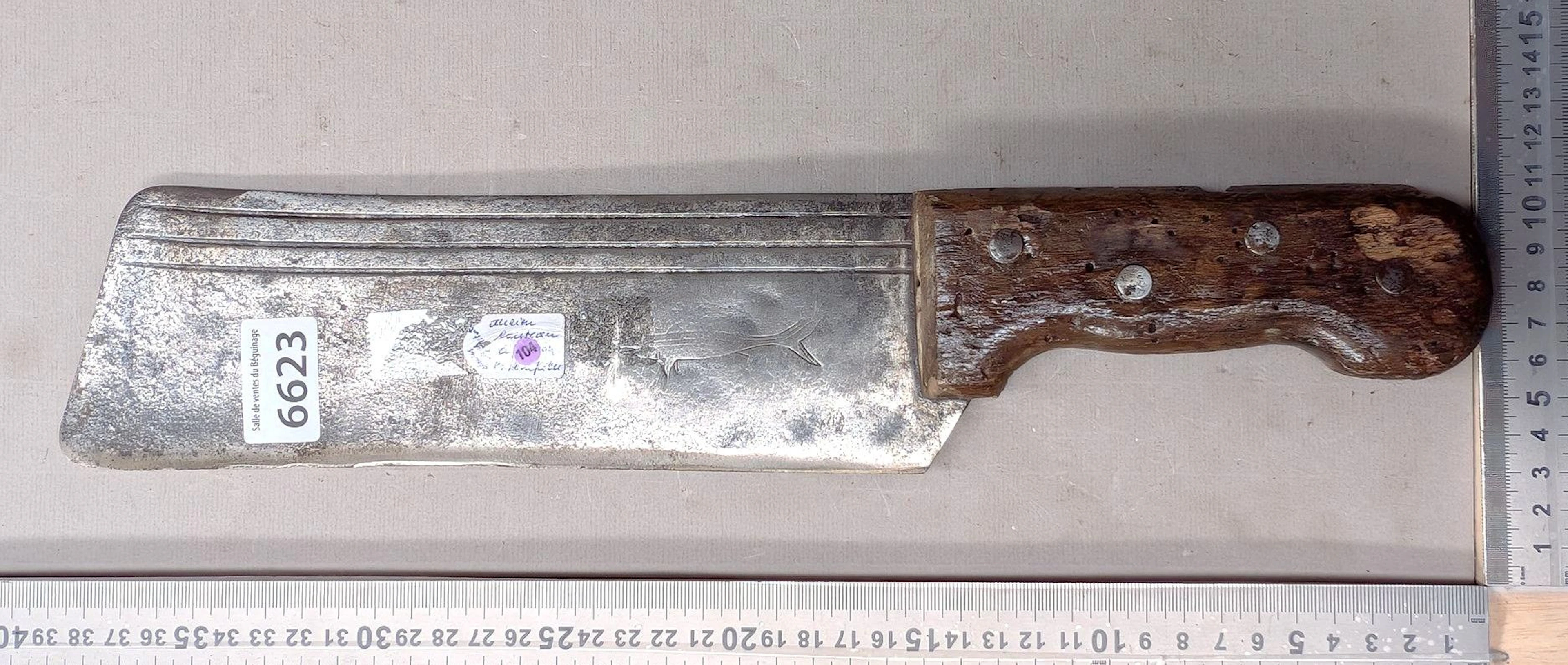 Antique cleaver with steel blade and wooden handle—see photos for