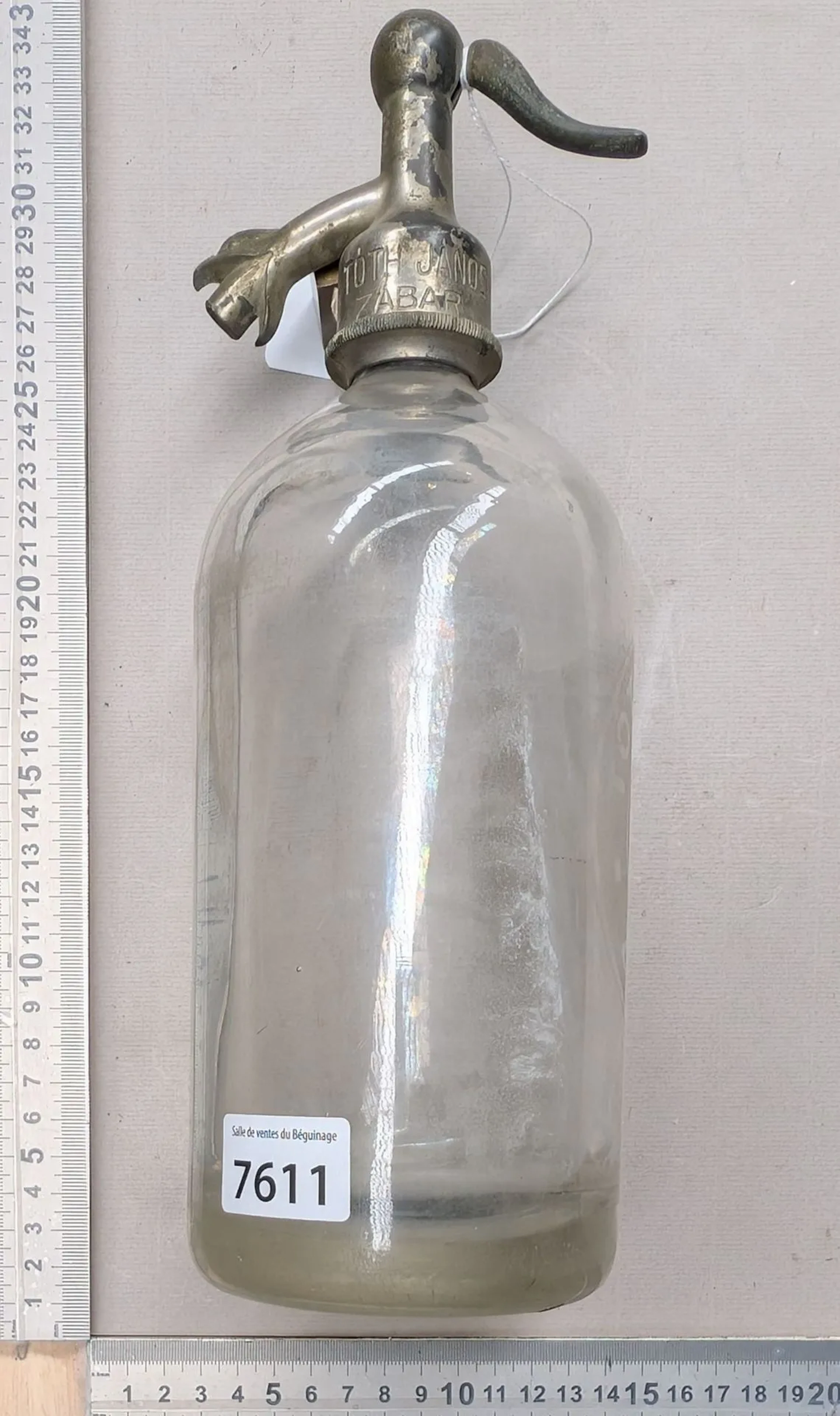 A lightweight siphon bottle with tin trim—see photos for dimensions