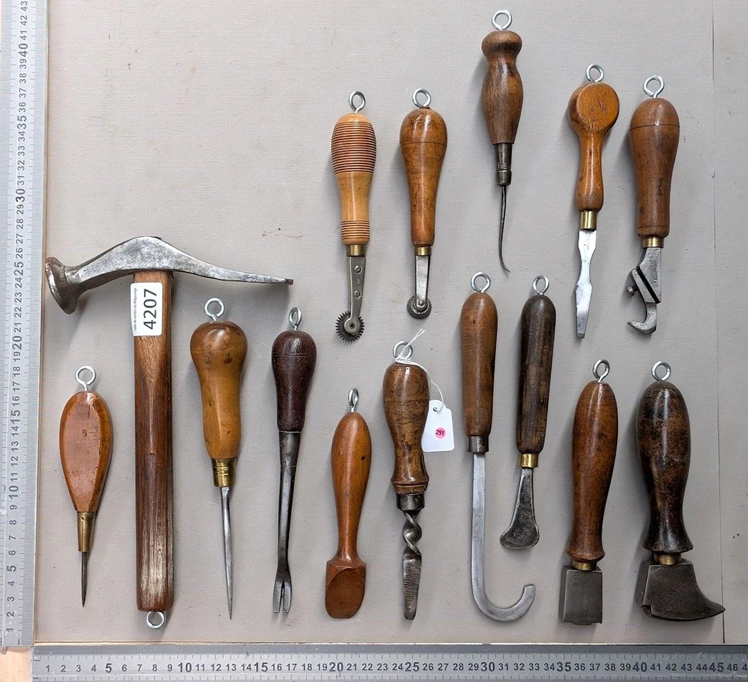 15 shoemaker's and saddler's tools on an oak base—see photos for dimensions
