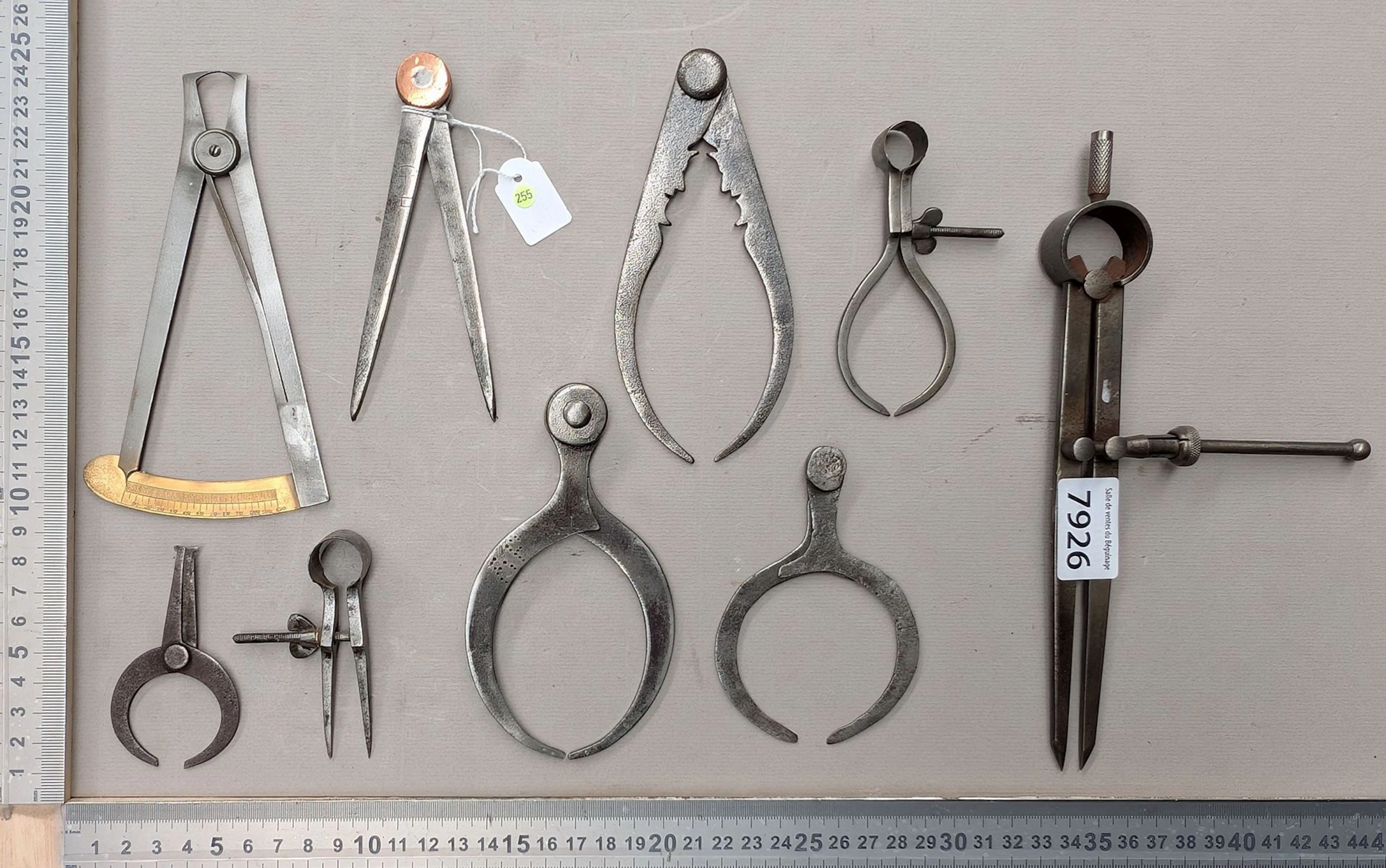 1 set of 9 different compasses—see photos for dimensions and condition