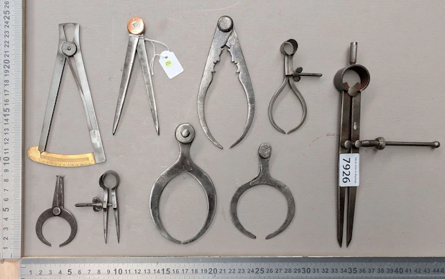 1 set of 9 different compasses—see photos for dimensions and condition