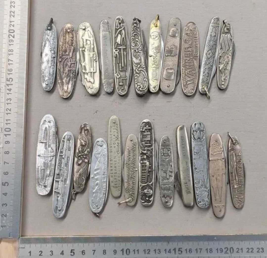 Set of 23 vintage promotional pocket knives from 1900—see photos for
