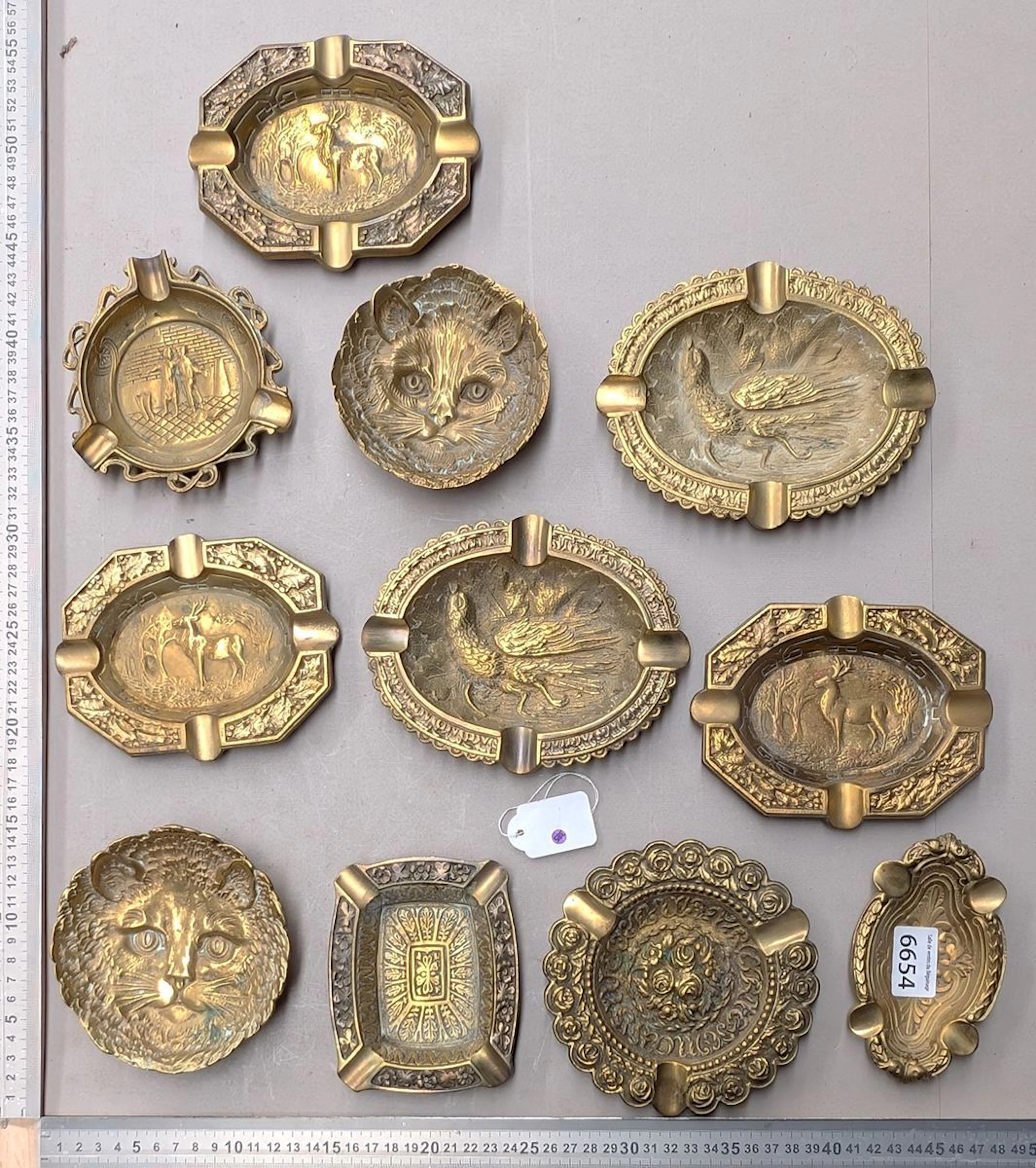 10 bronze ashtrays with different designs—see photos for dimensions