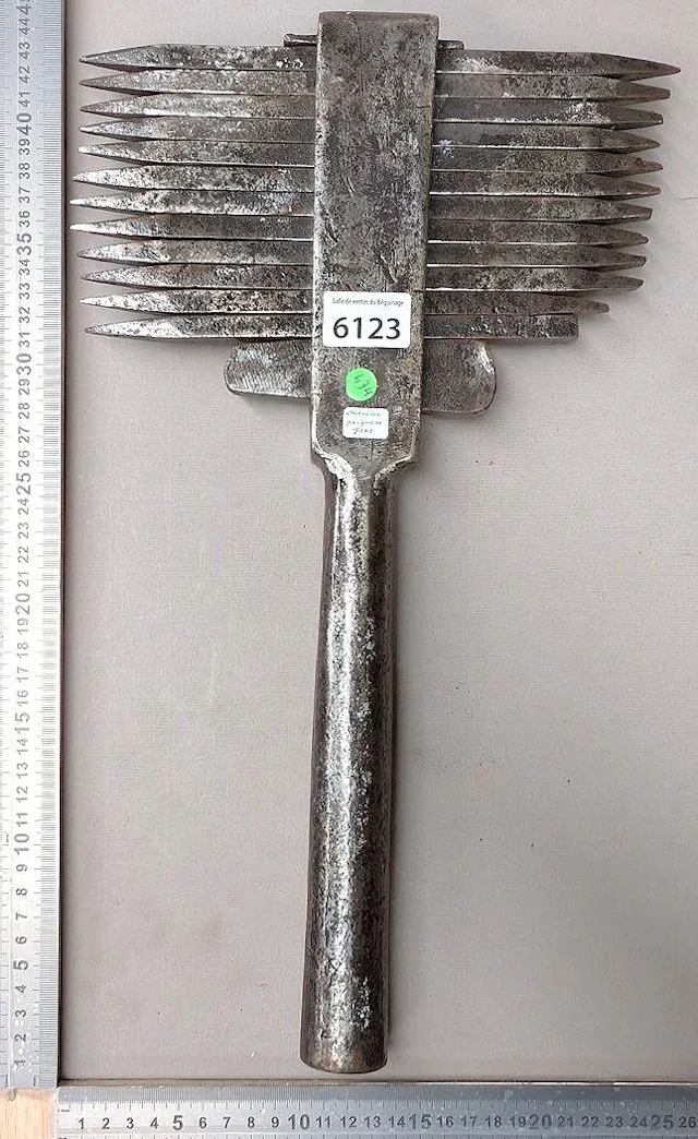 An antique sandstone comb—see photos for dimensions and condition