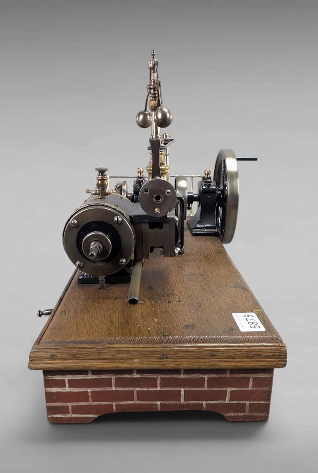 Antique steam engine on a wooden base—see photos for dimensions and condition