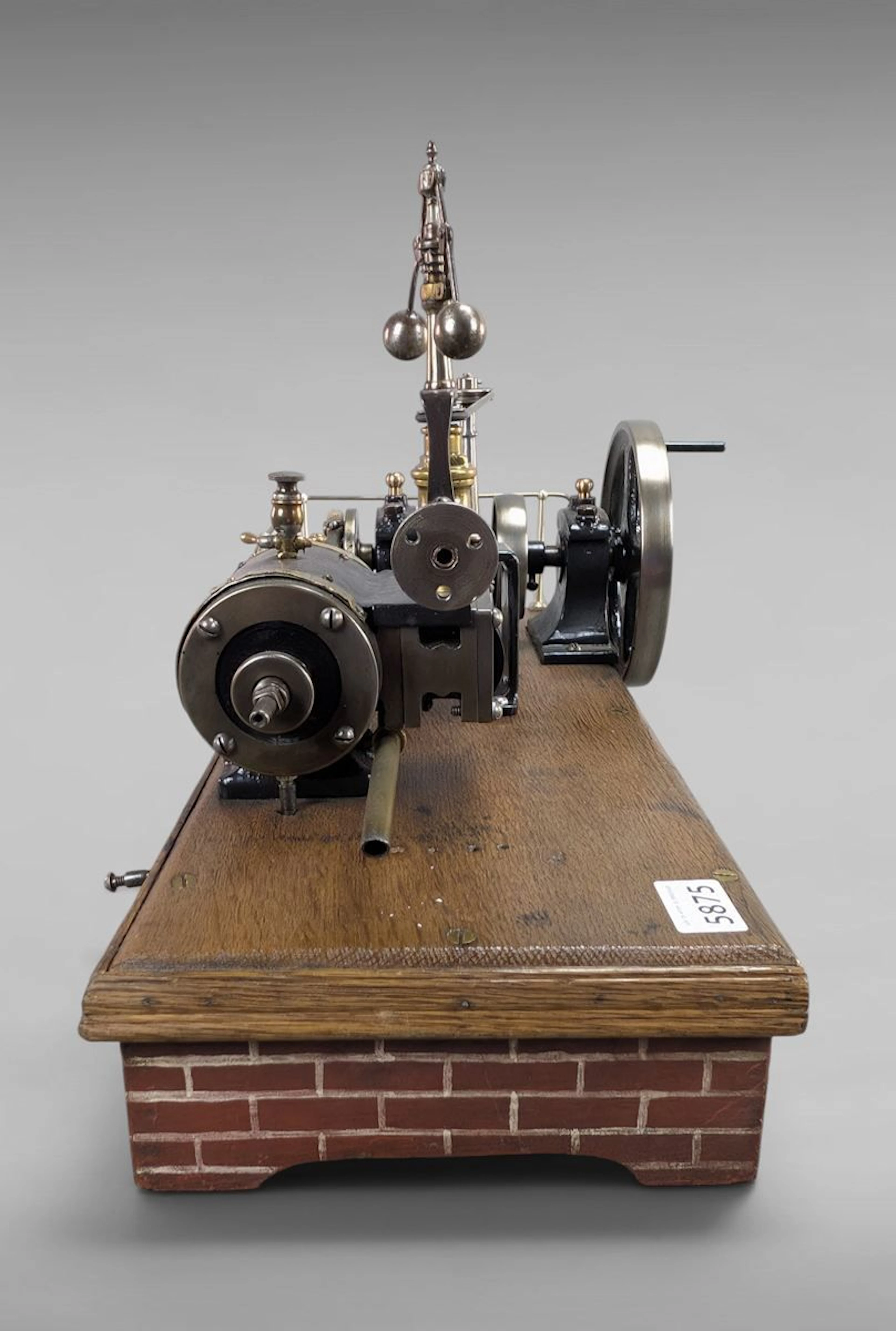 Antique steam engine on a wooden base—see photos for dimensions and condition