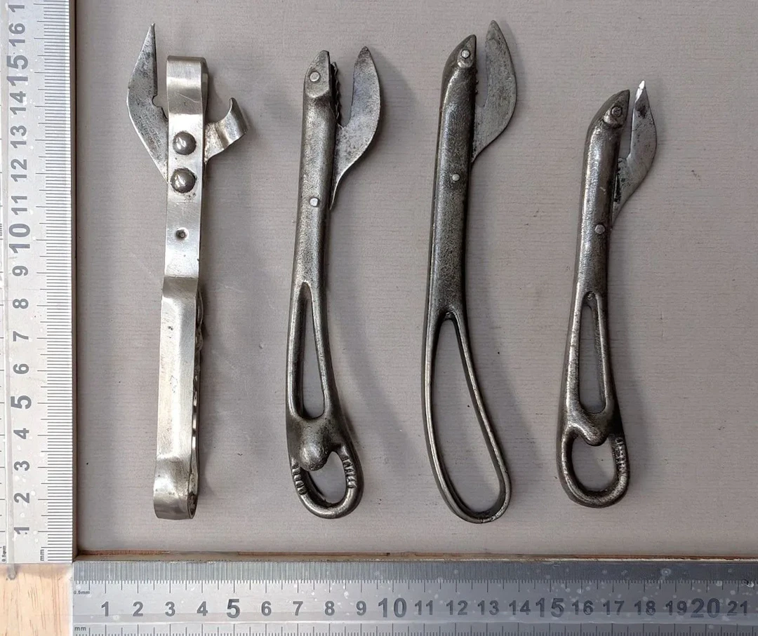 4 antique can openers—see photos for dimensions and condition