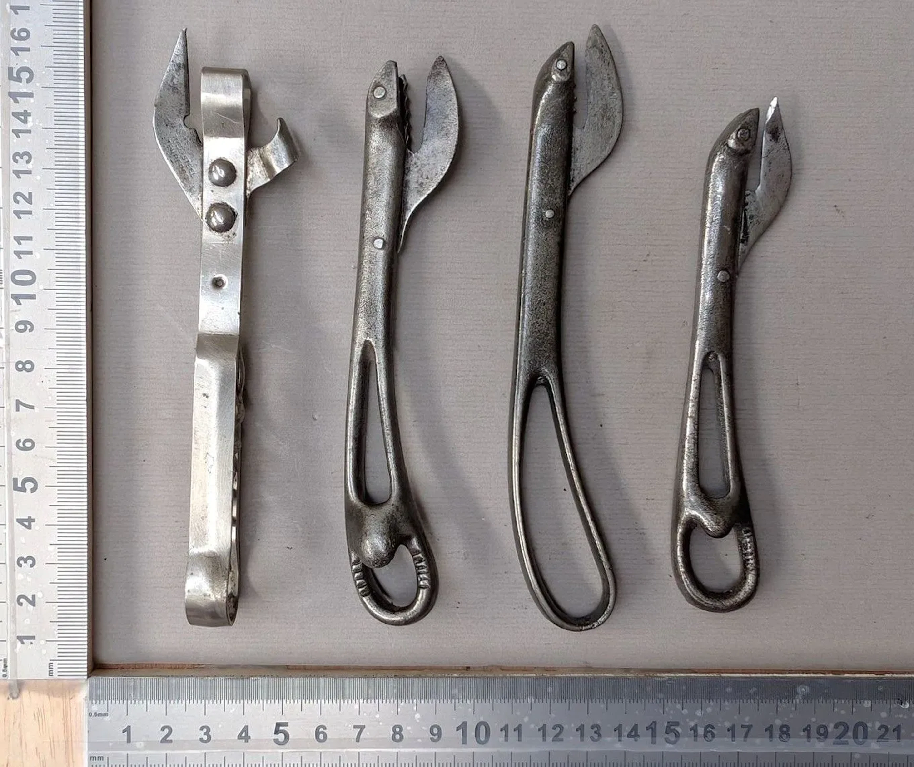4 antique can openers—see photos for dimensions and condition