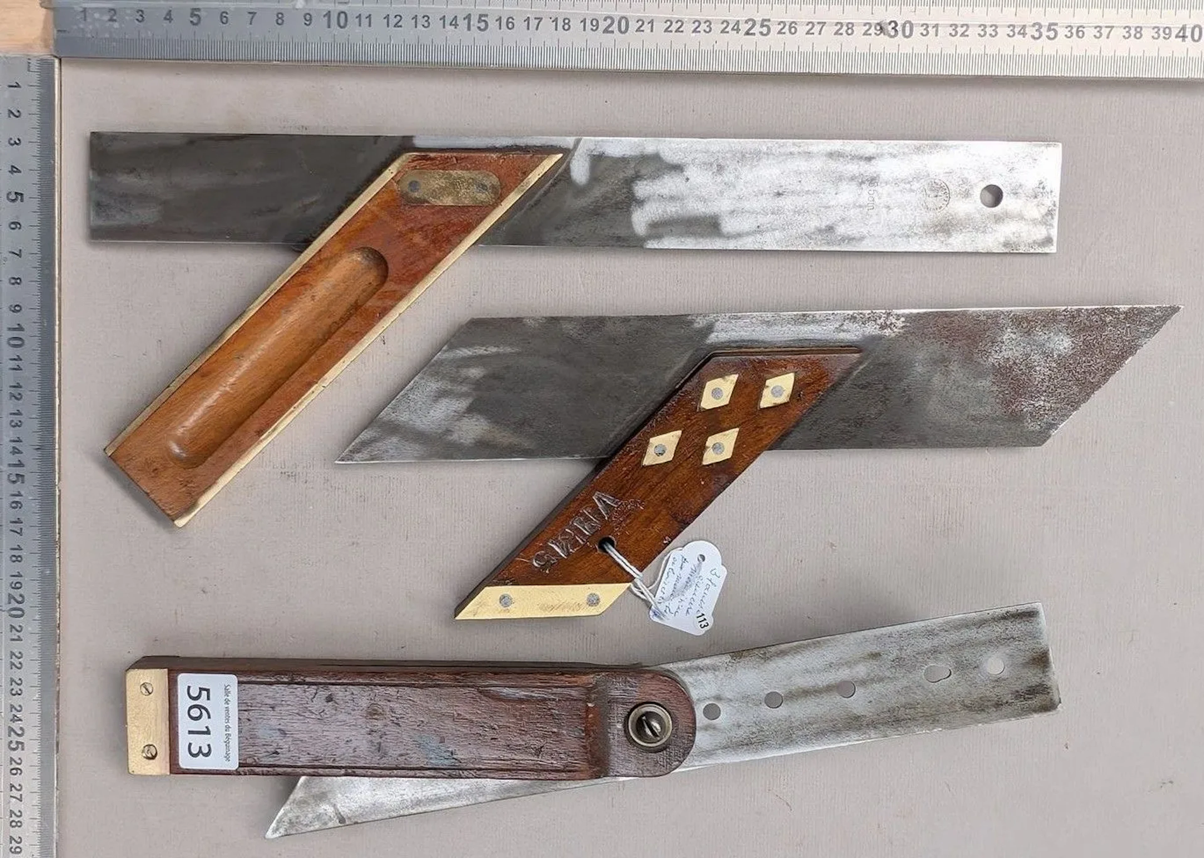 3 used carpenter's squares, with wooden handles and brass fittings—see