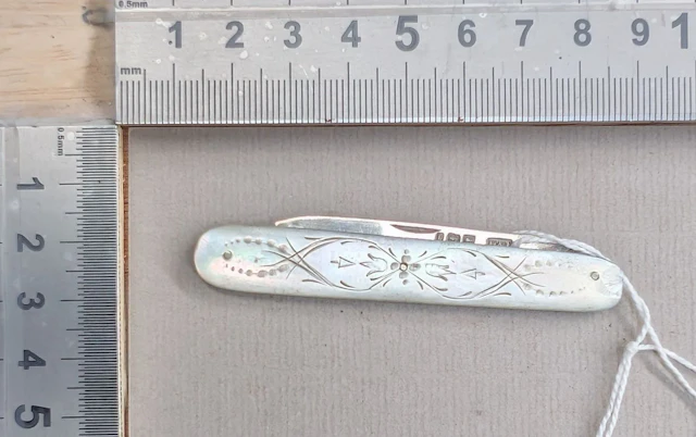 1 antique fruit knife with a silver blade and mother-of-pearl handle—see