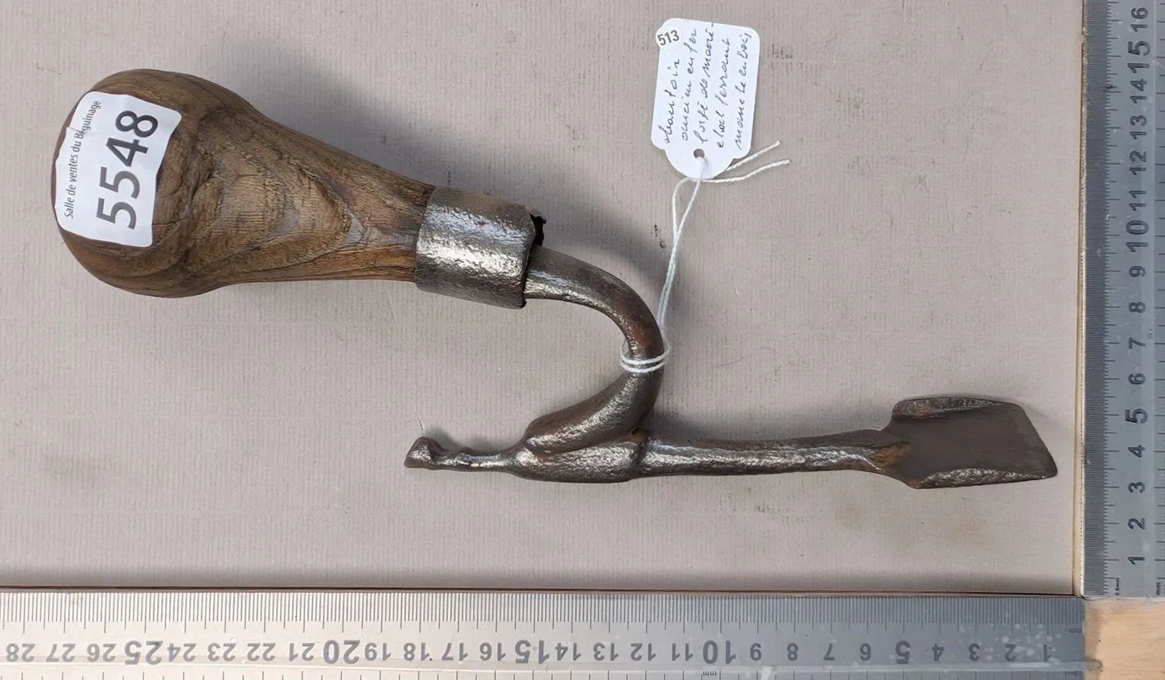 Antique wrought-iron rammer with a farrier's wooden handle—see photos