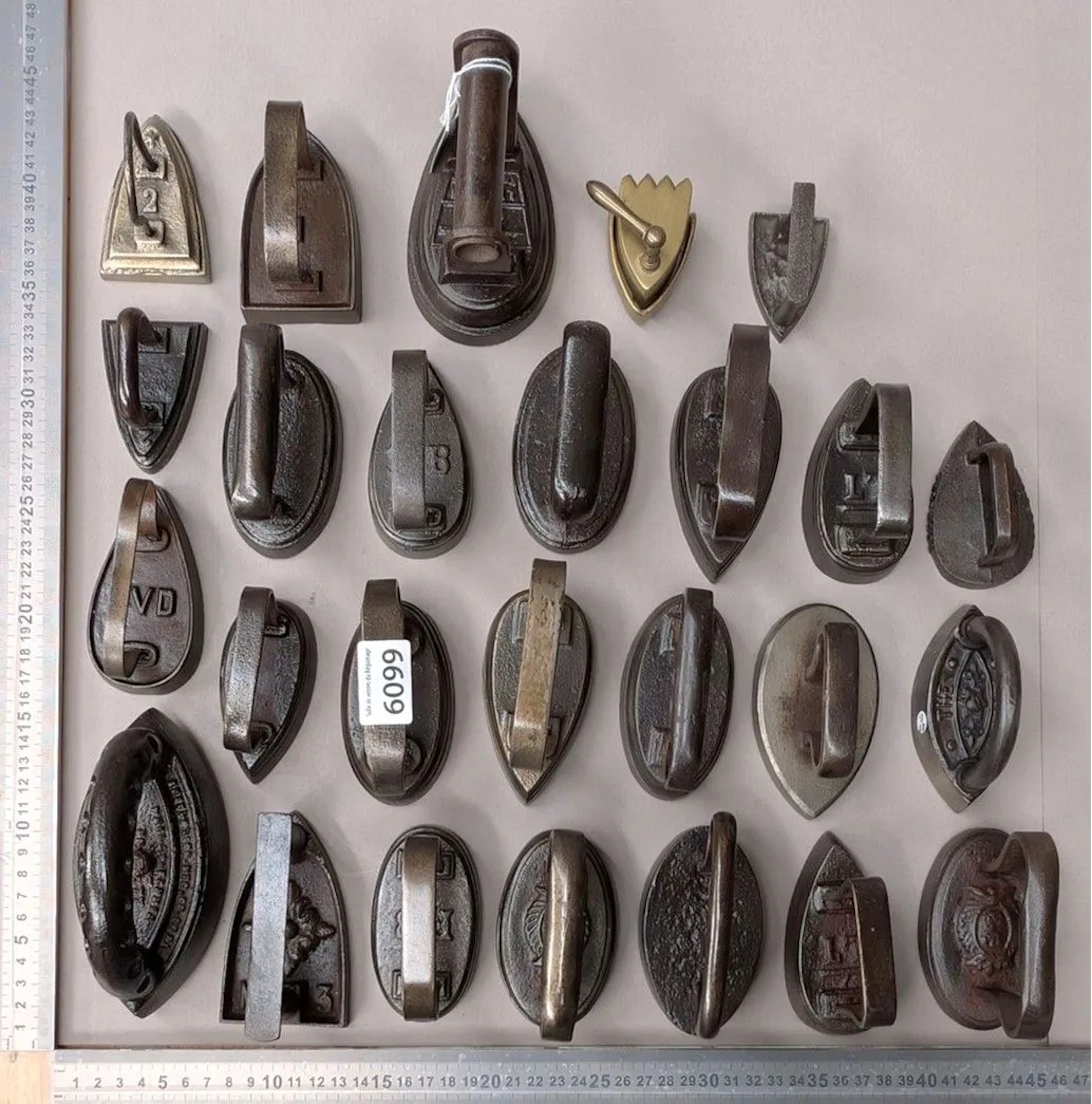 Set of 26 small irons—see photos for dimensions and condition
