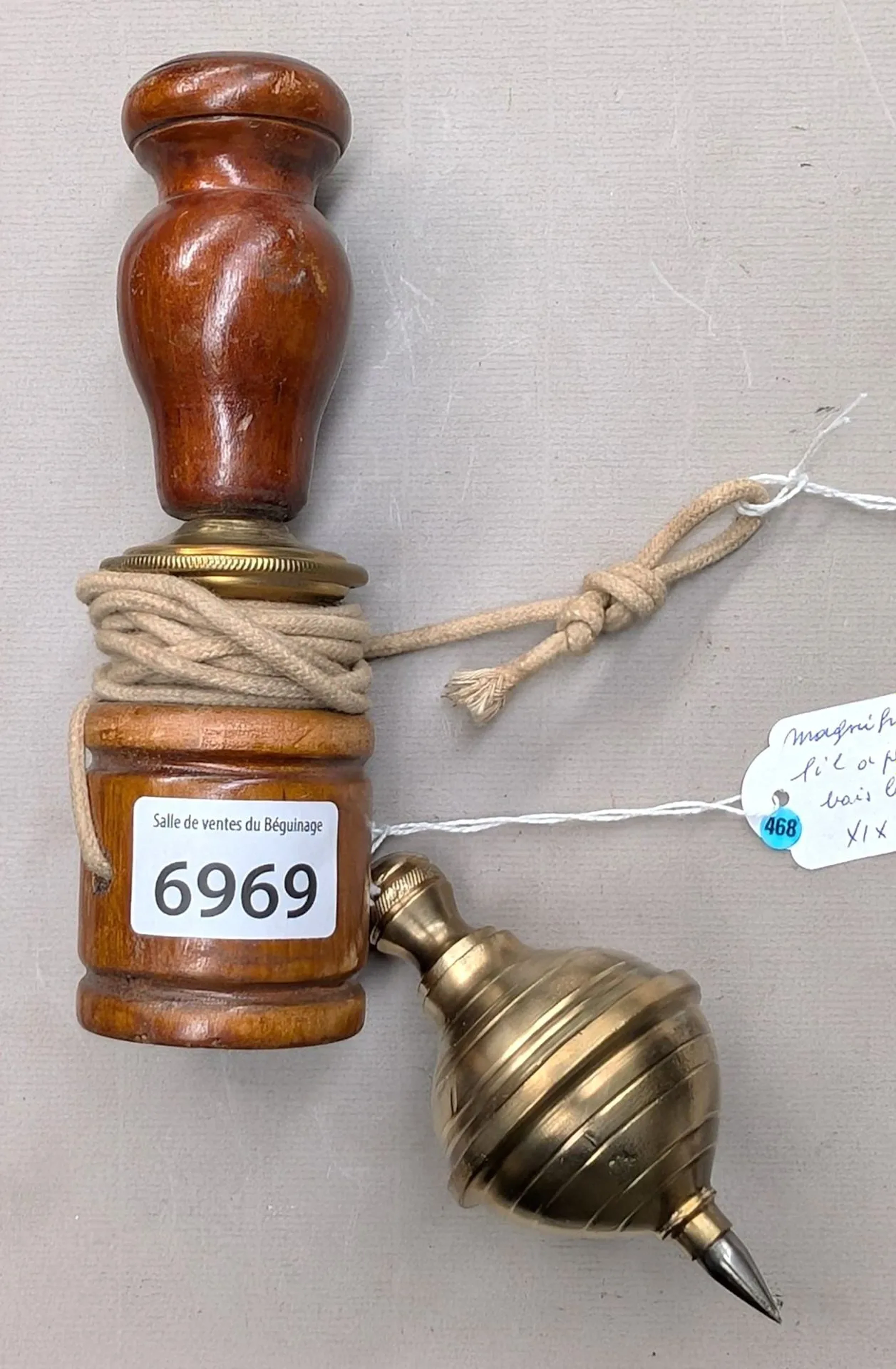 Beautiful 19th-century bronze-tipped wooden plumb bob—see photos for
