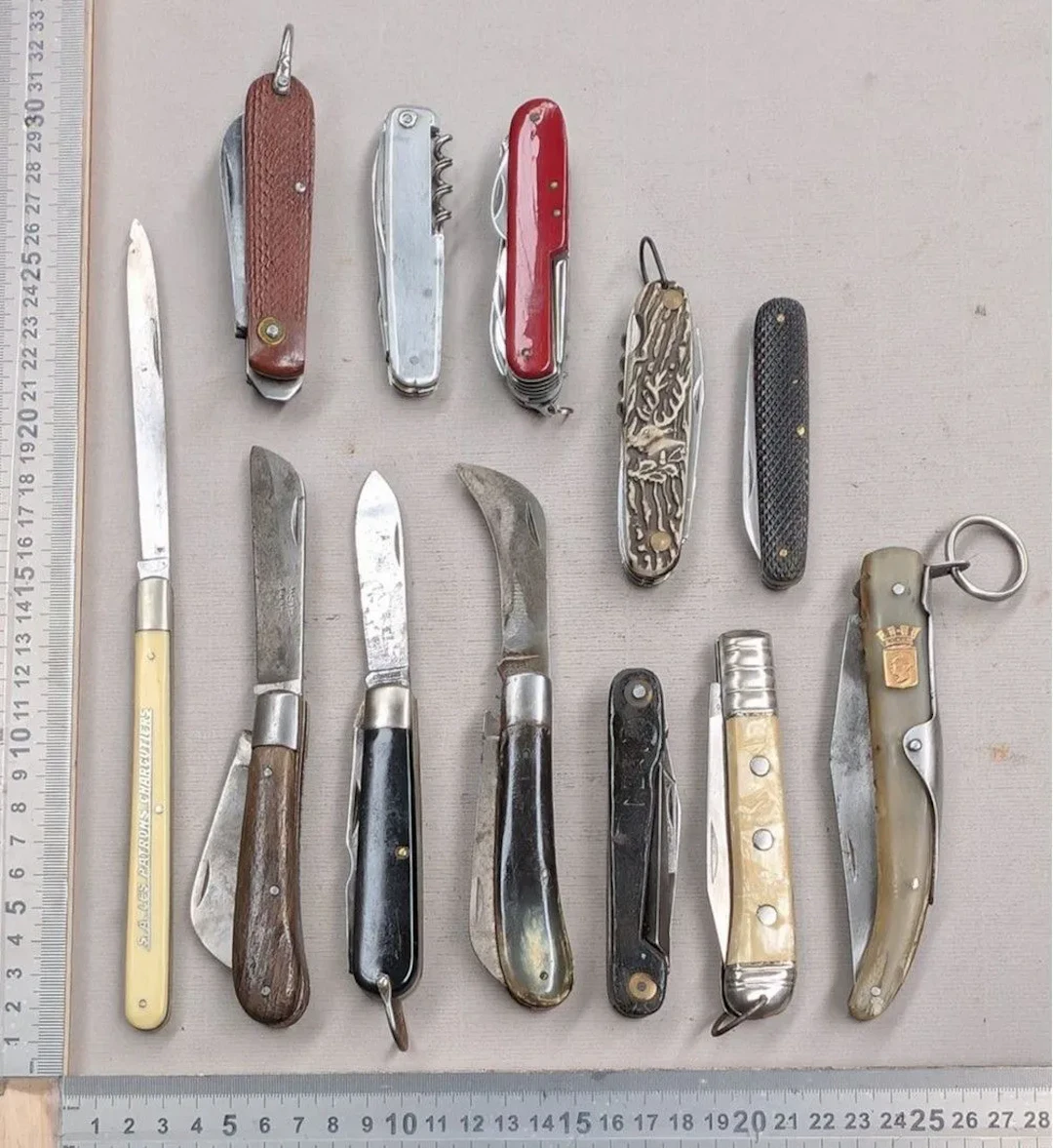 Set of 12 different vintage pocket knives, 1930–1950—see photos for