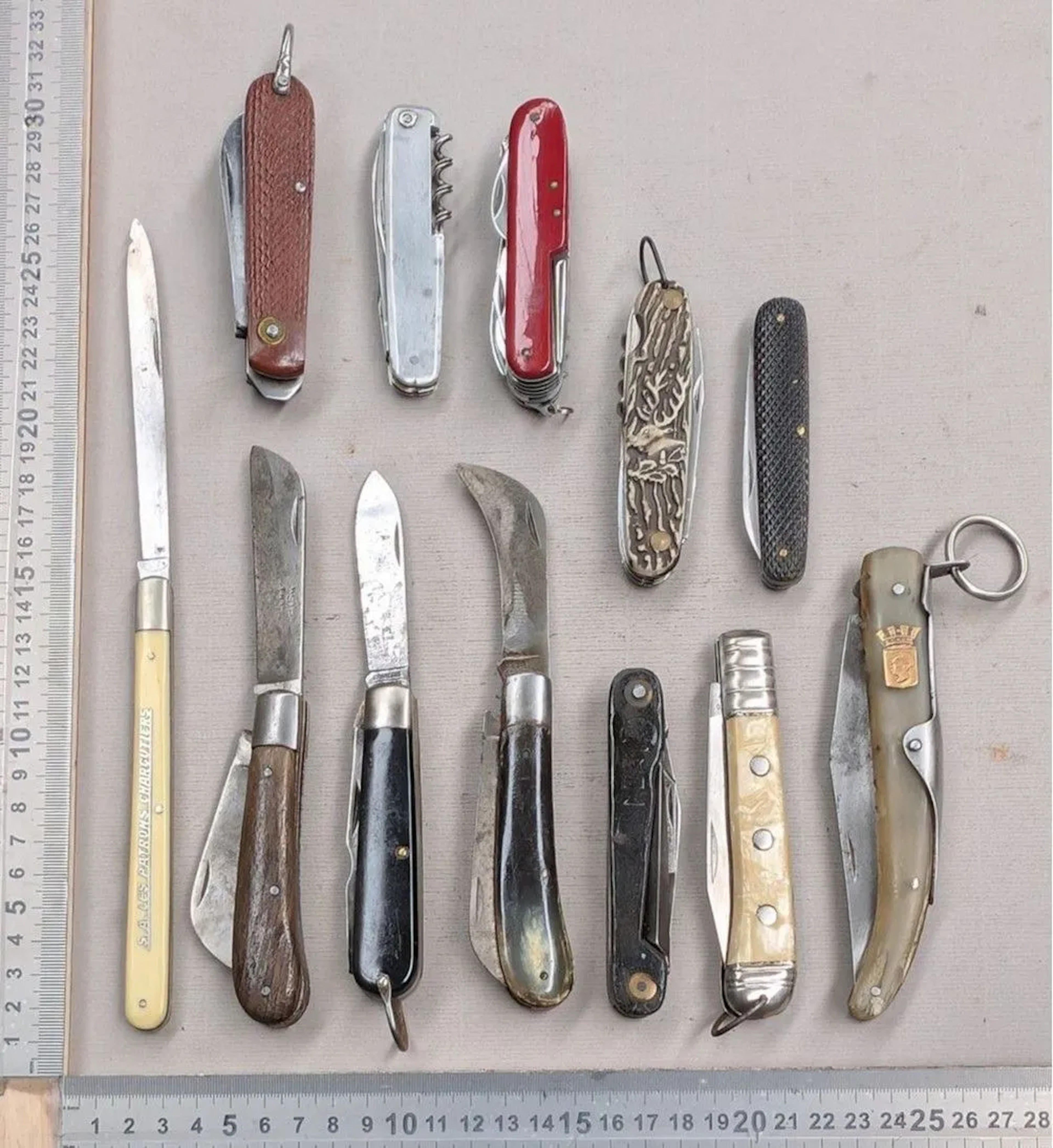 Set of 12 different vintage pocket knives, 1930–1950—see photos for