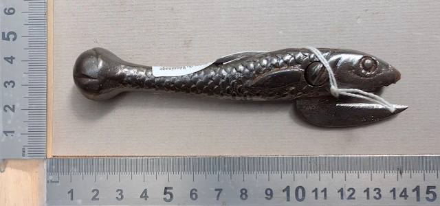 1 antique cast-iron can opener shaped like a fish—see photos for dimensions