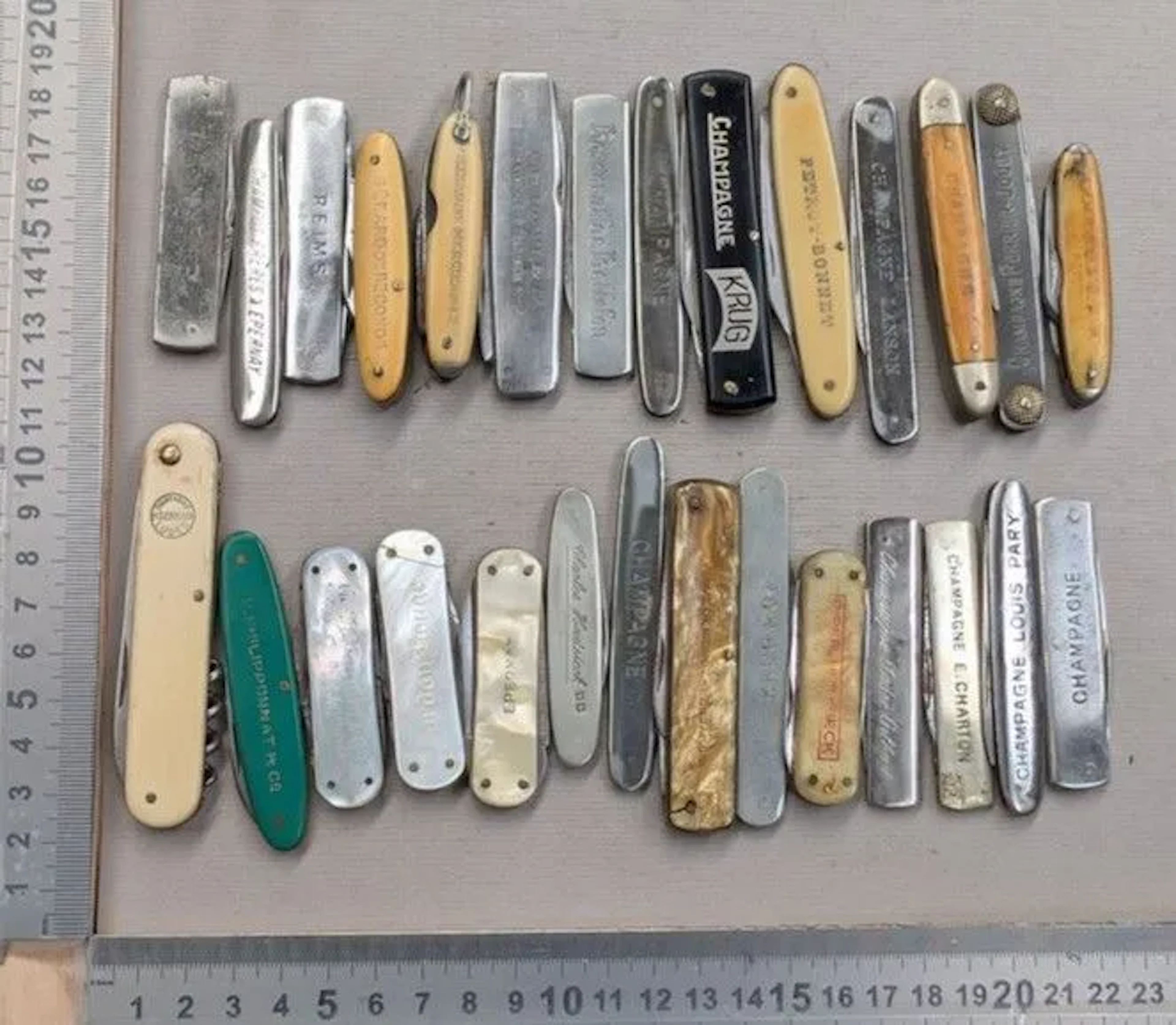 Set of 28 vintage promotional pocket knives from a Champagne House