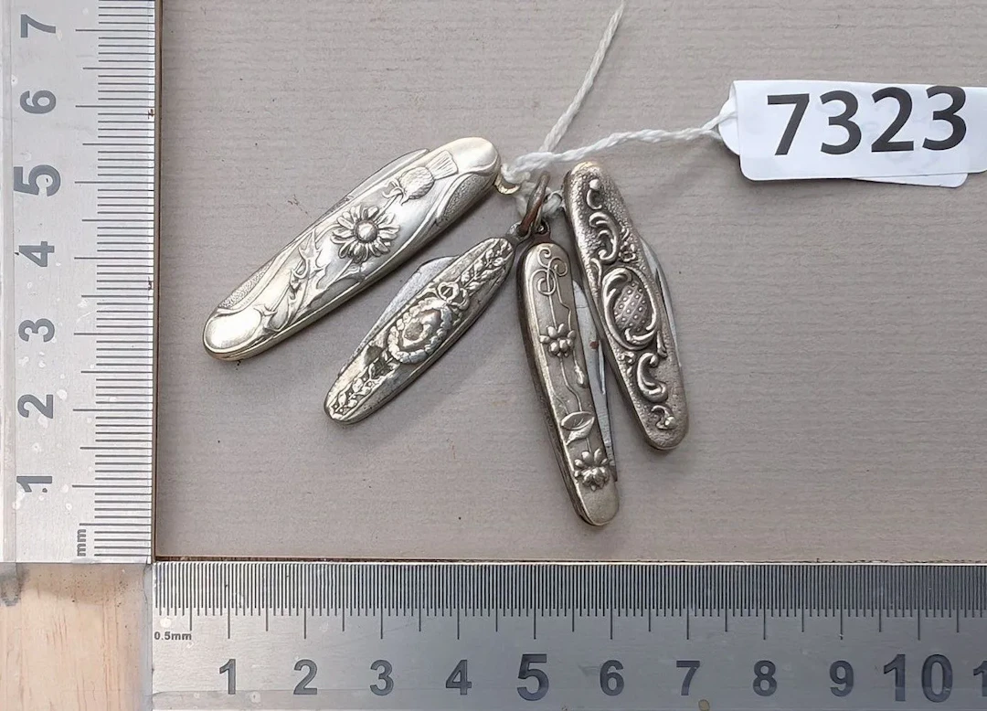 4 small silver knives—see photos for dimensions and condition